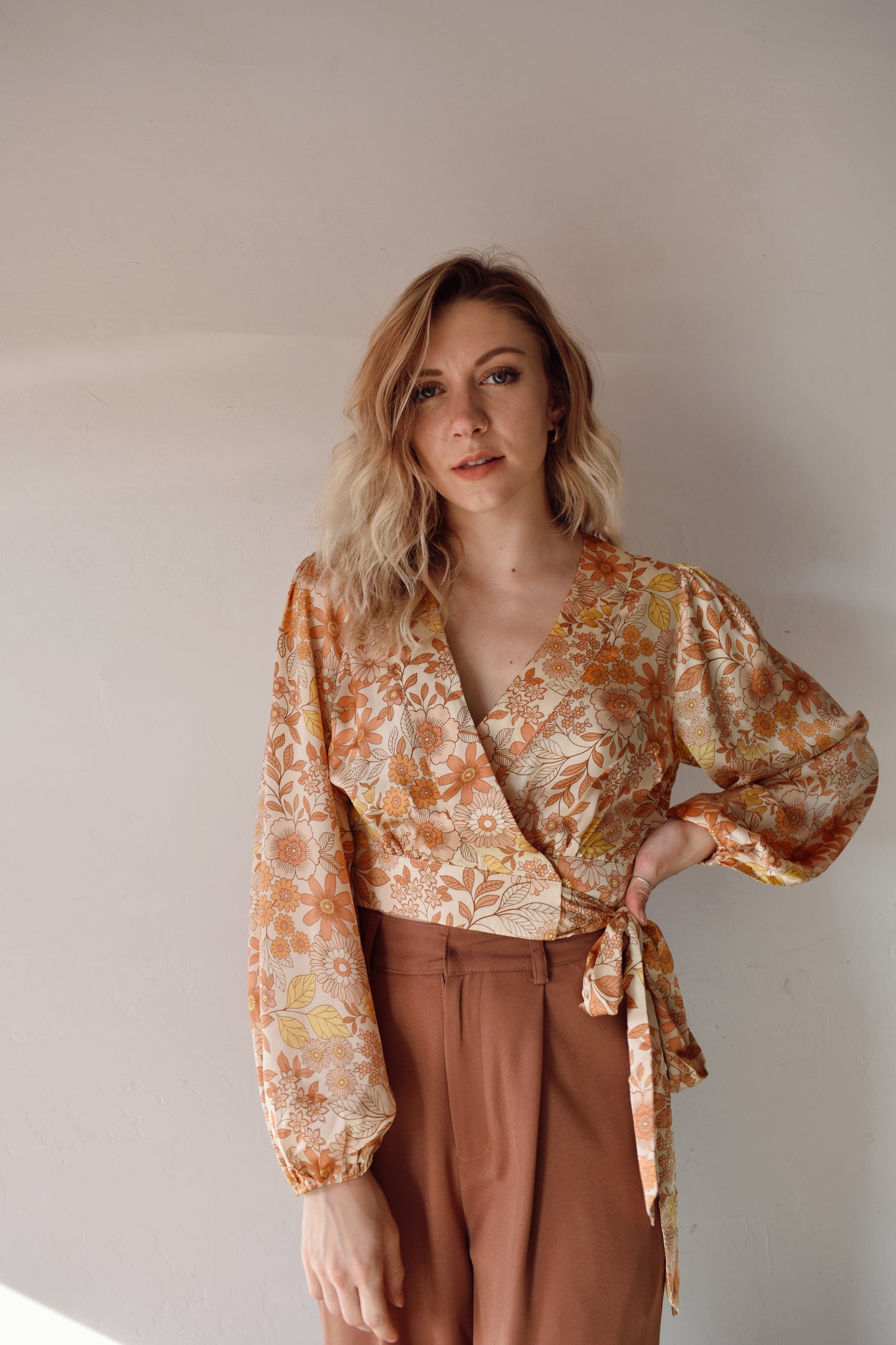 satin fabric, yellow, orange and cream floral cropped wrap blouse with elastic hem at sleeves