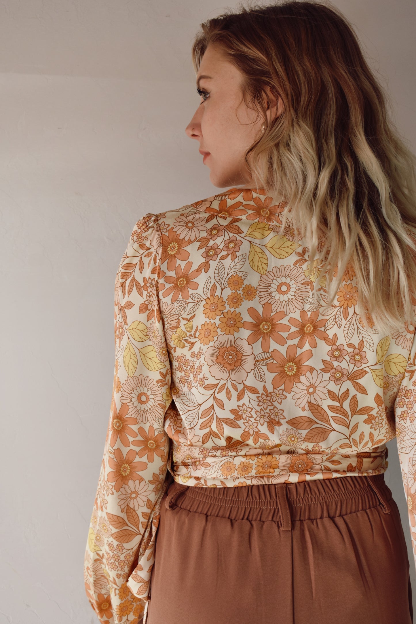 satin fabric, yellow, orange and cream floral cropped wrap blouse with elastic hem at sleeves
