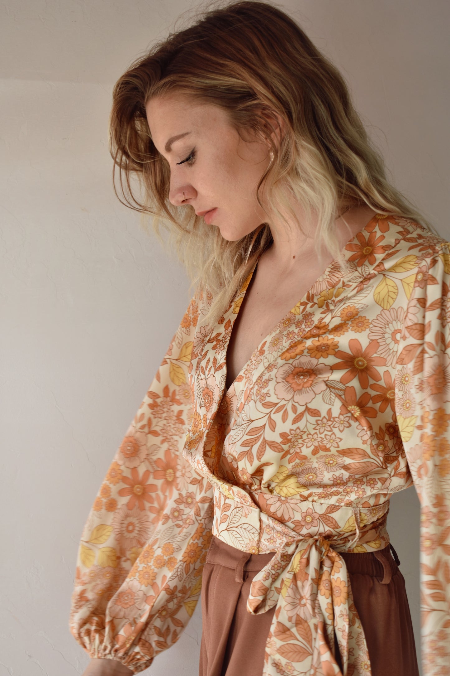satin fabric, yellow, orange and cream floral cropped wrap blouse with elastic hem at sleeves