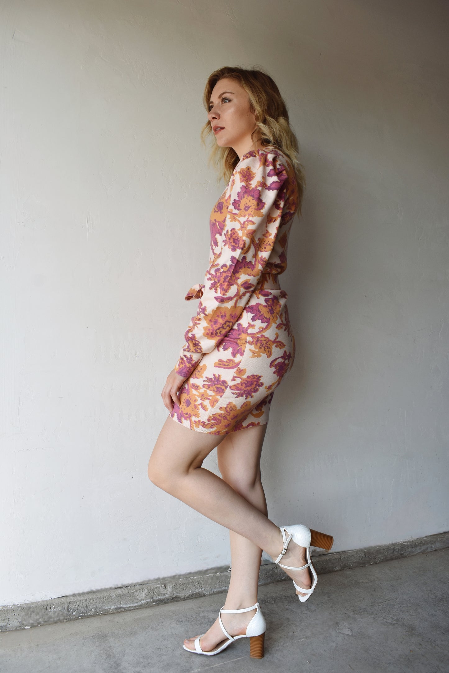 fuchsia, terracotta, and cream floral patterned mini sweater dress with tie and puff shoulder long sleeves