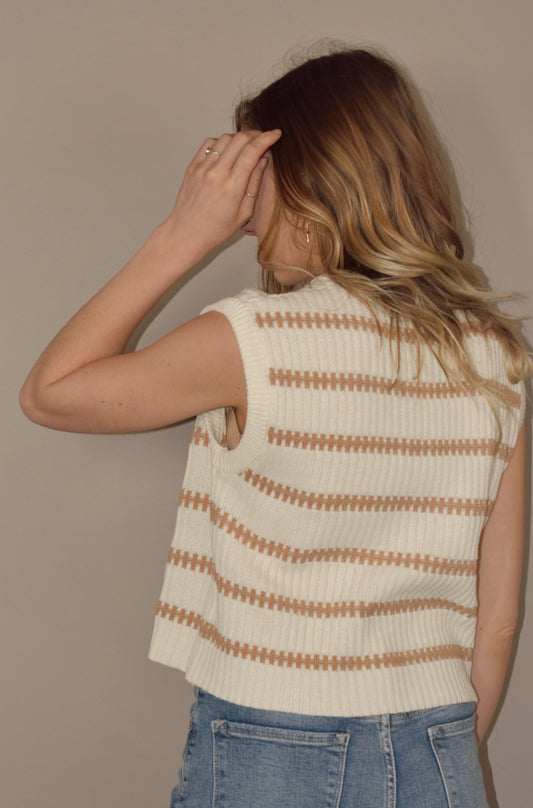 cream sweater tank with terracotta horizontal stripes. hits at waist. crew neck. slightly boxy fit. 