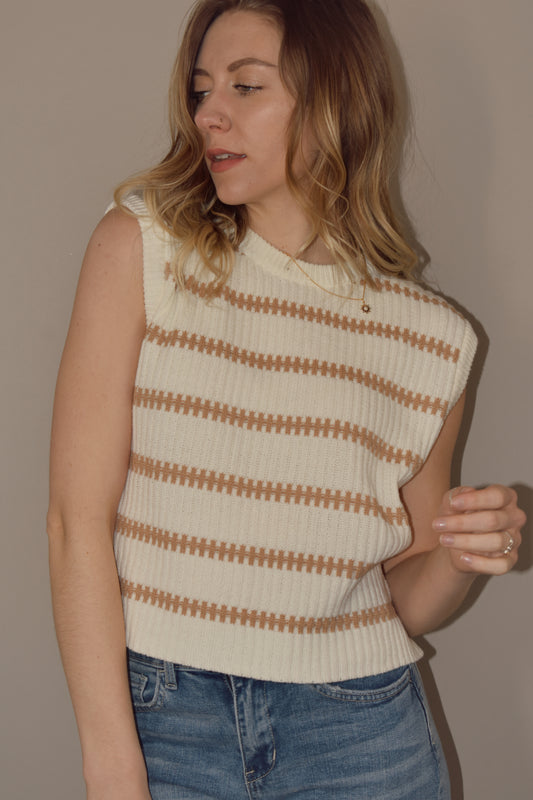 cream sweater tank with terracotta horizontal stripes. hits at waist. crew neck. slightly boxy fit. 