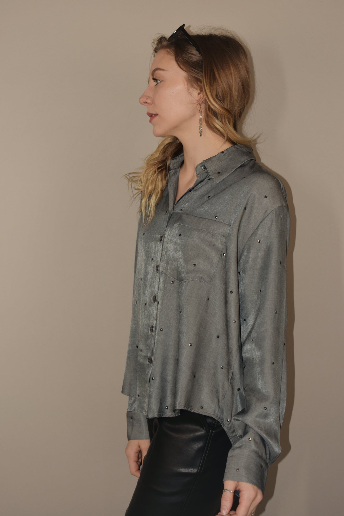 long sleeve relaxed fit full length charcoal button down. small silver studs all over the shirt. one breast pocket. 