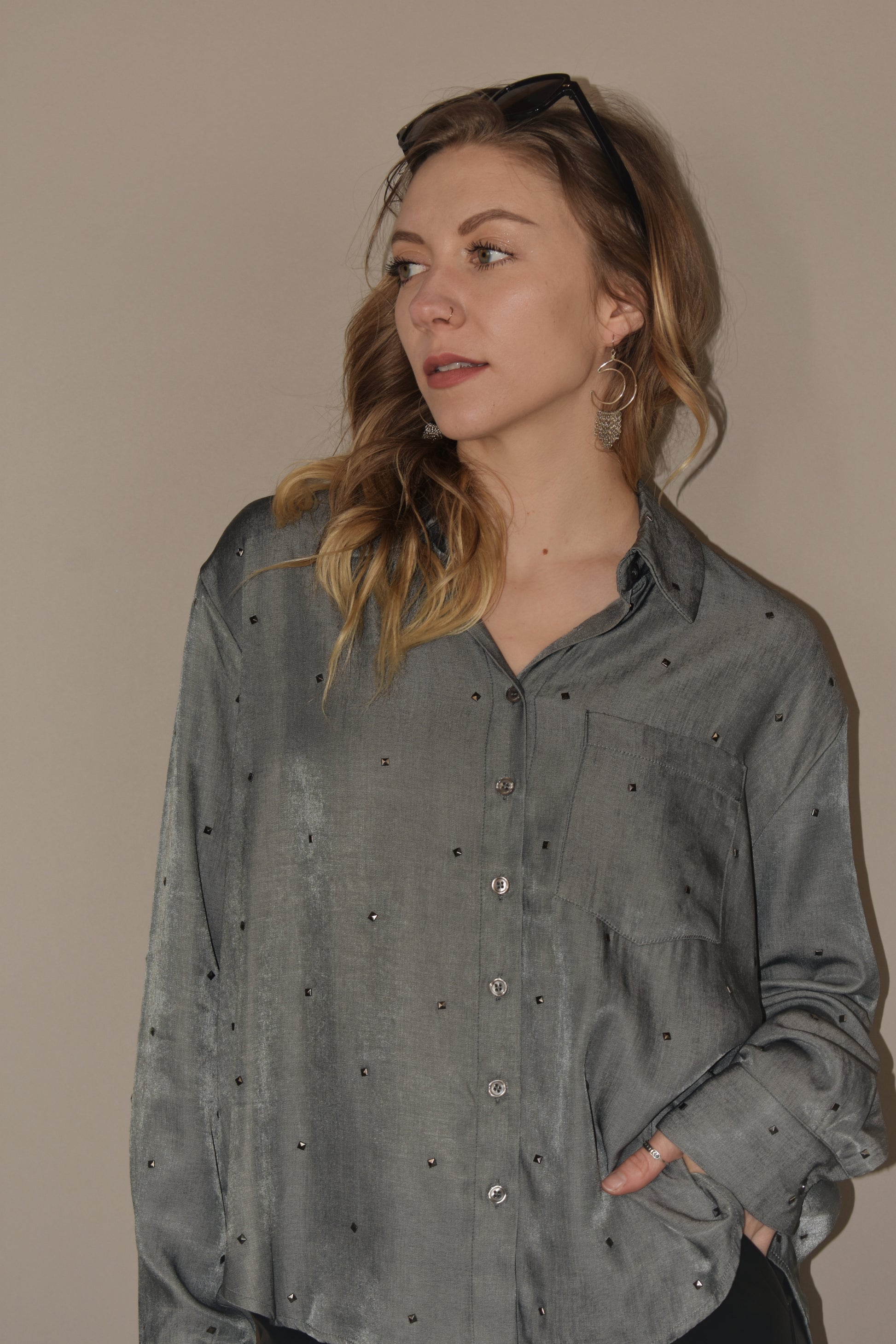 long sleeve relaxed fit full length charcoal button down. small silver studs all over the shirt. one breast pocket. 