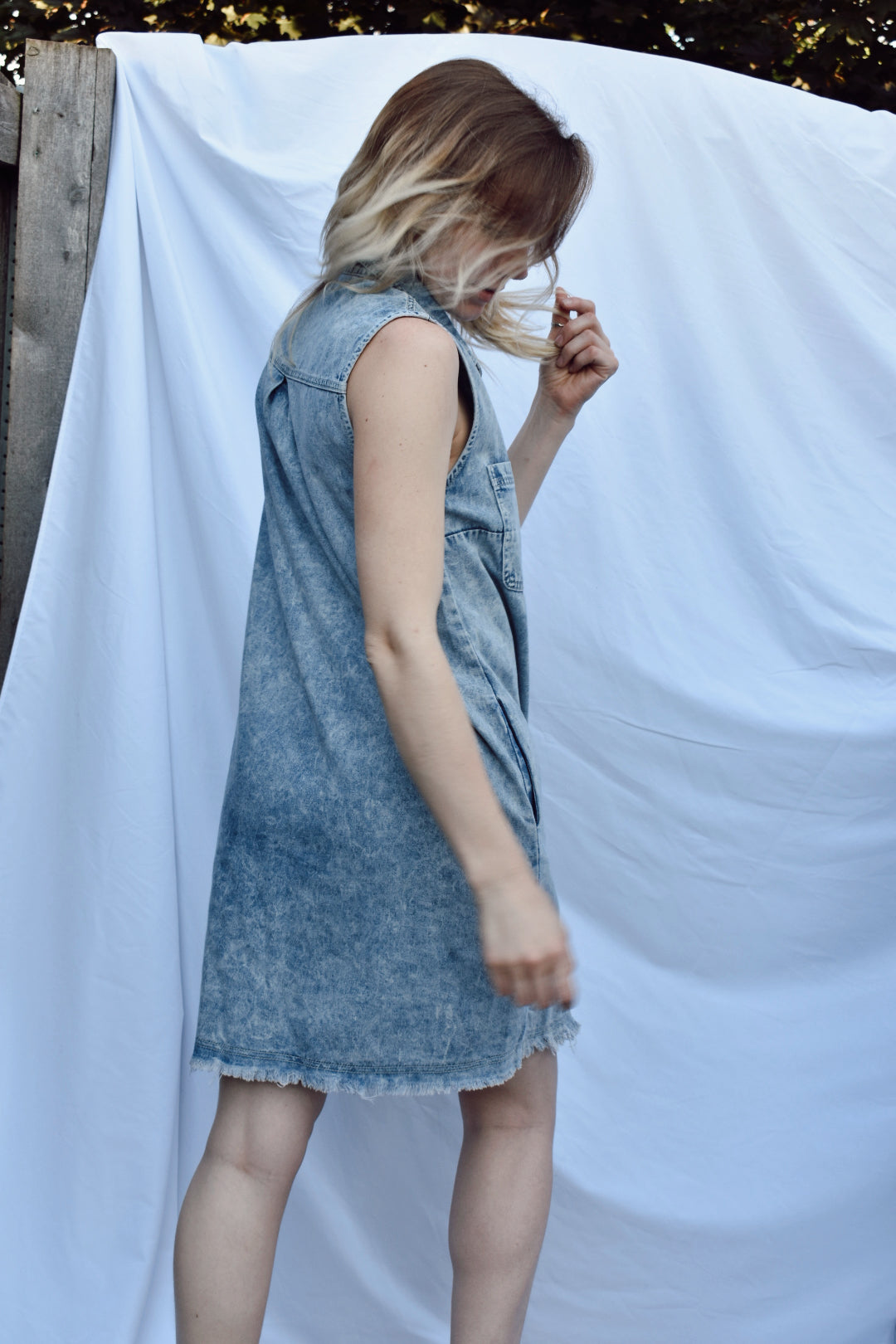 acid wash denim and raw edge frayed hem mini dress button down collar with pockets Bluivy the revival