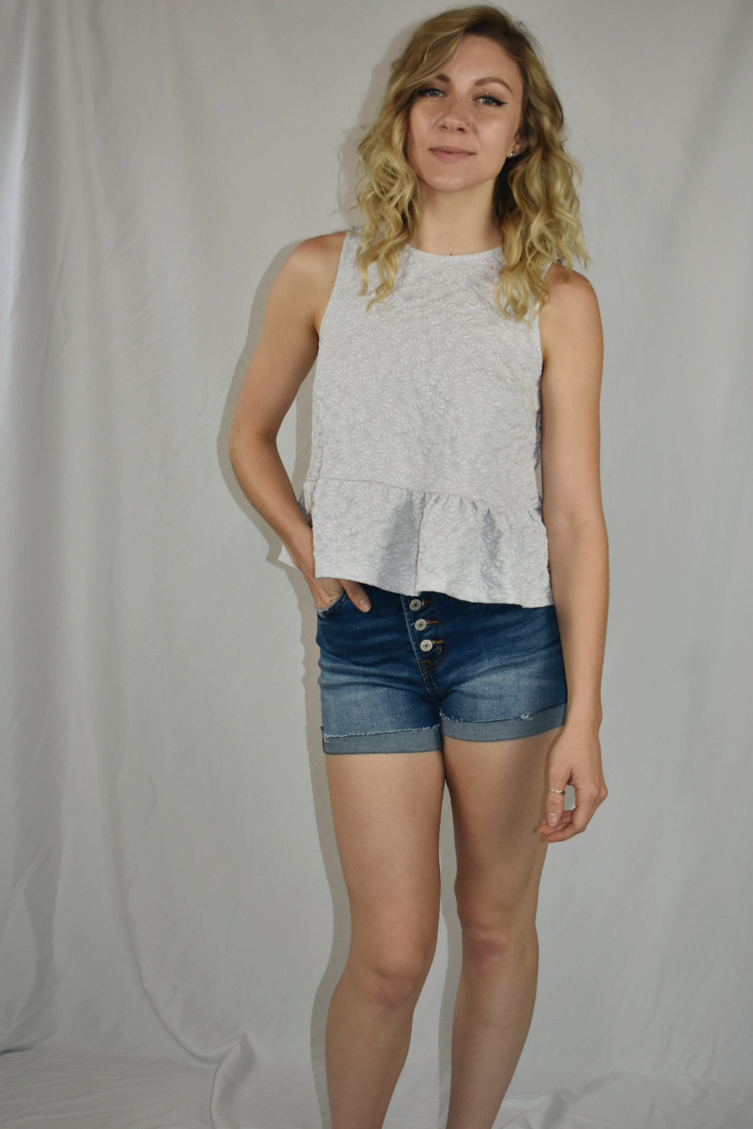daisy textured jacquard top keyhole back with button and a ruffle hem at the bottom Mittoshop the revival