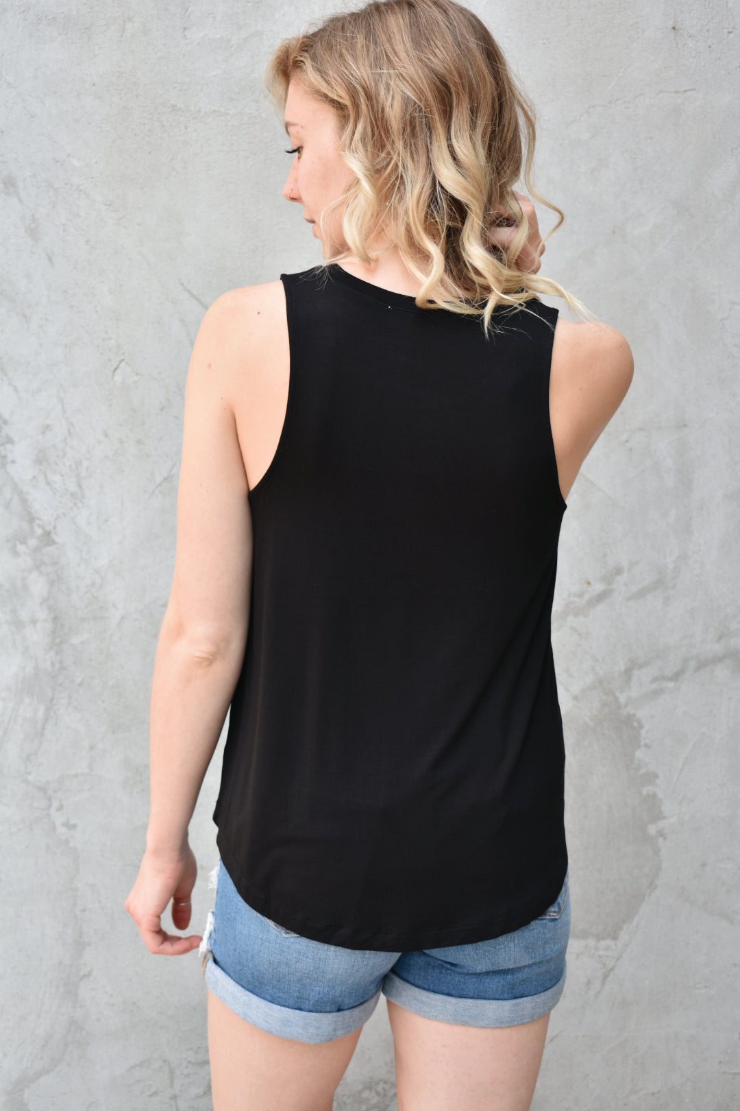 Lightweight black tank crew neckline medium length hem. Brand is Hyfve