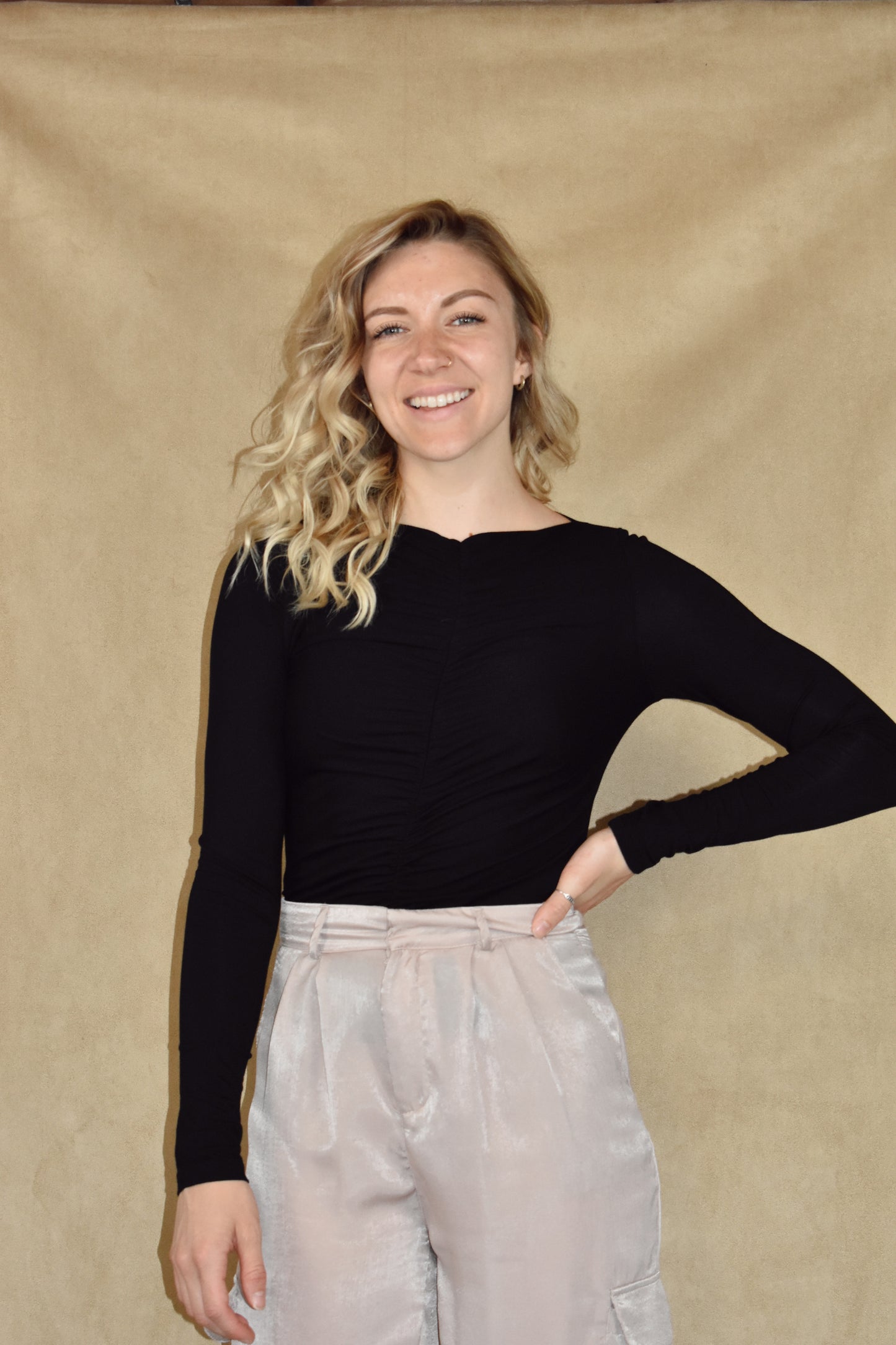 long sleeve full length fitted top with ruching down center of front and back and a boat neckline