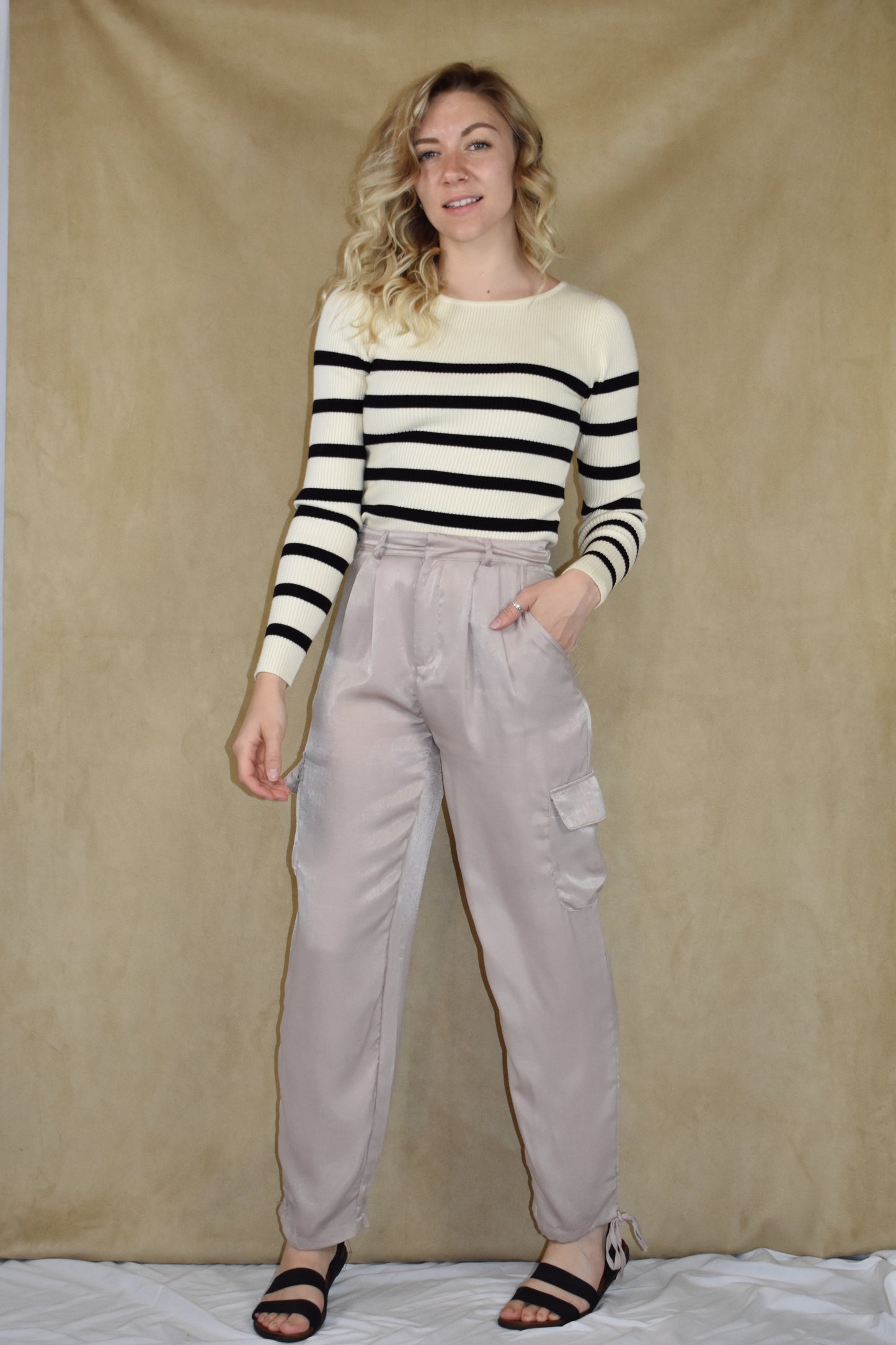 dusty rose satin cargo pants. side pockets with top flap and drawstring on the bottom.