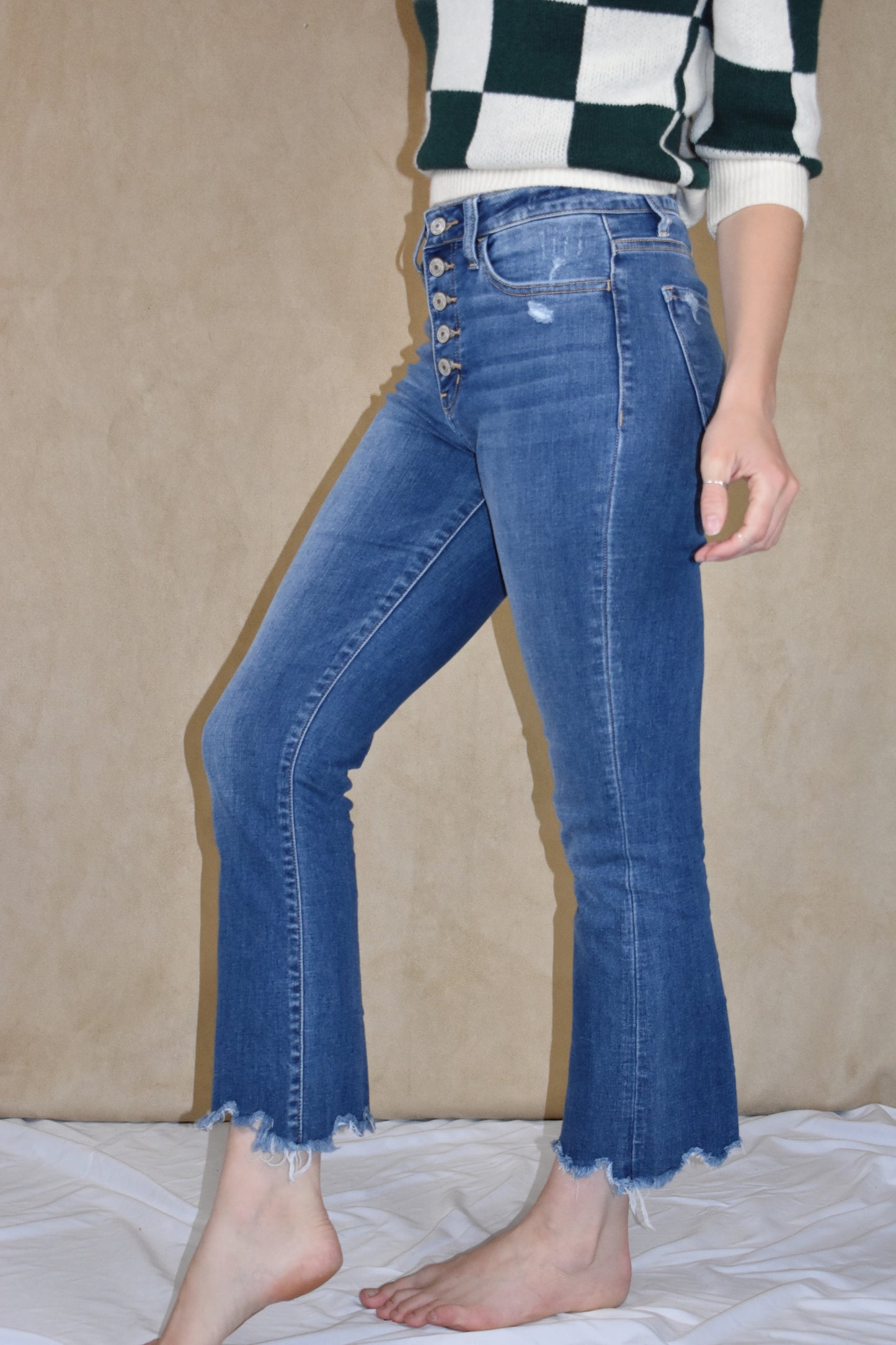 highwaisted cropped flare jeans. stretch denim with button fly and a raw hem. Vervet.