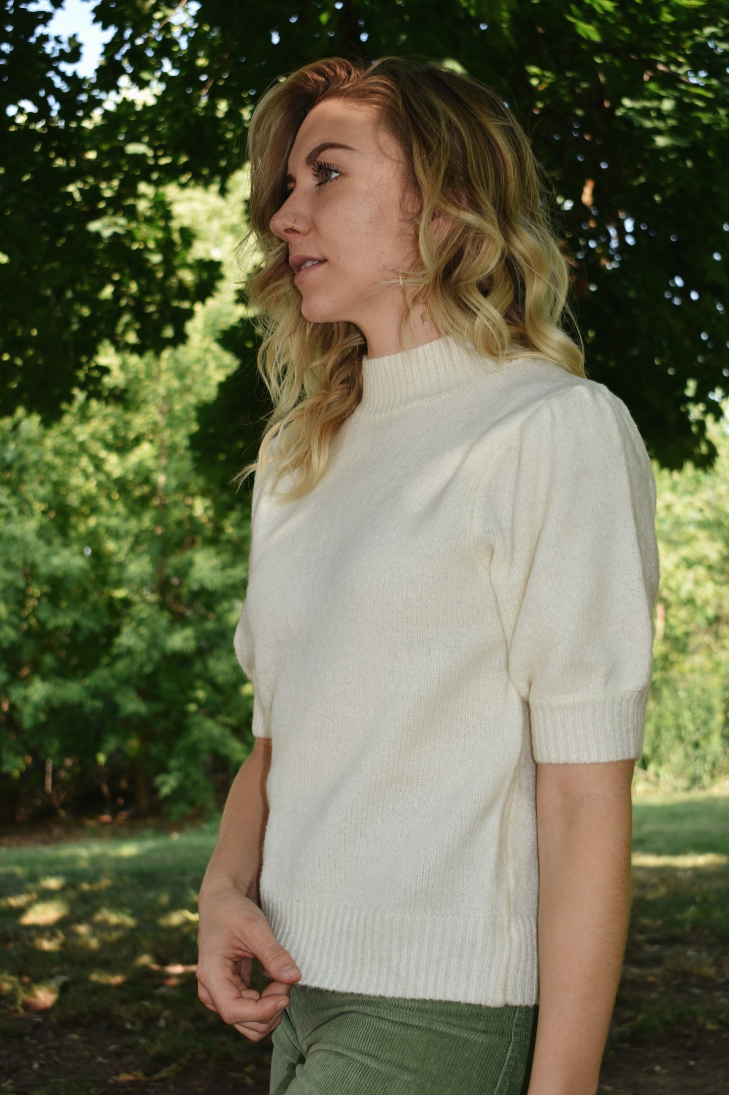 Cream mod neck short puff sleeve sweater with a tailored fit with a ribbed neck and cuffs. Sleeves hit just above the elbow.