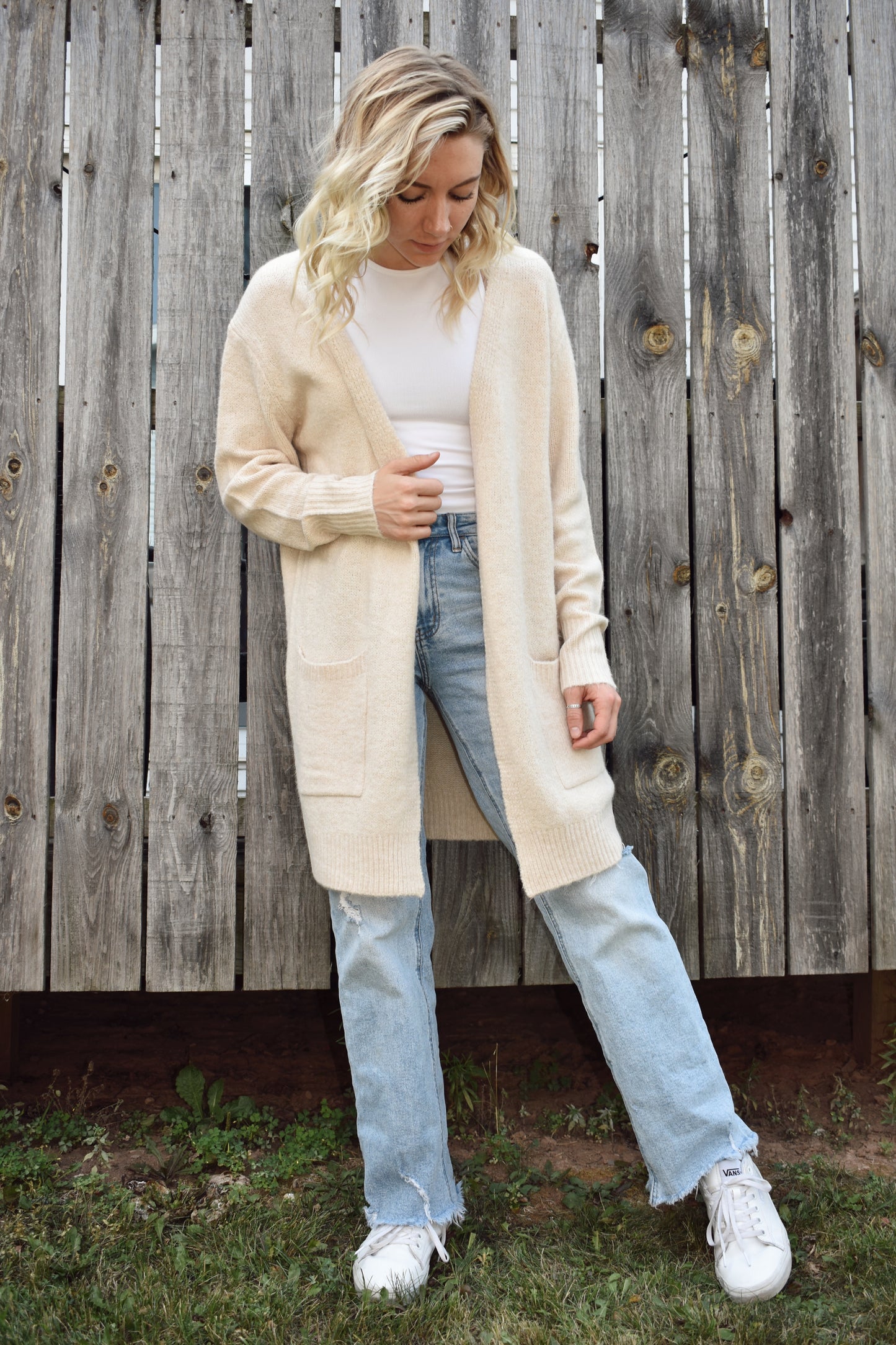 Open front knit cardigan in a natural color hits just above the knees and has two front patch pockets super cozy