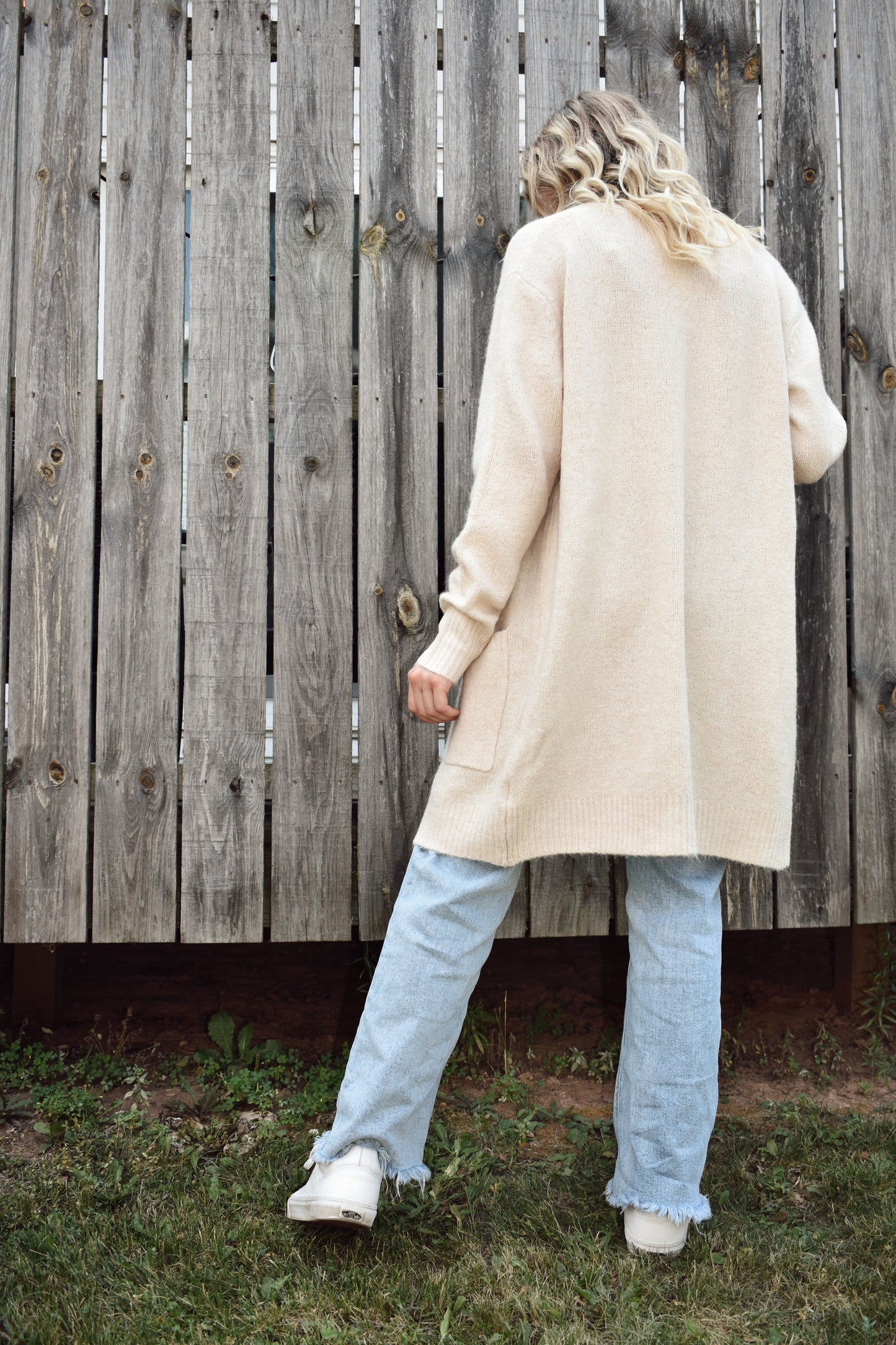 Open front knit cardigan in a natural color hits just above the knees and has two front patch pockets super cozy