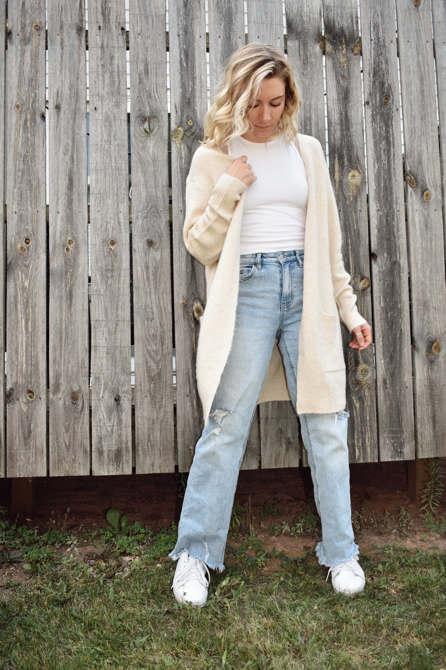 Open front knit cardigan in a natural color hits just above the knees and has two front patch pockets super cozy