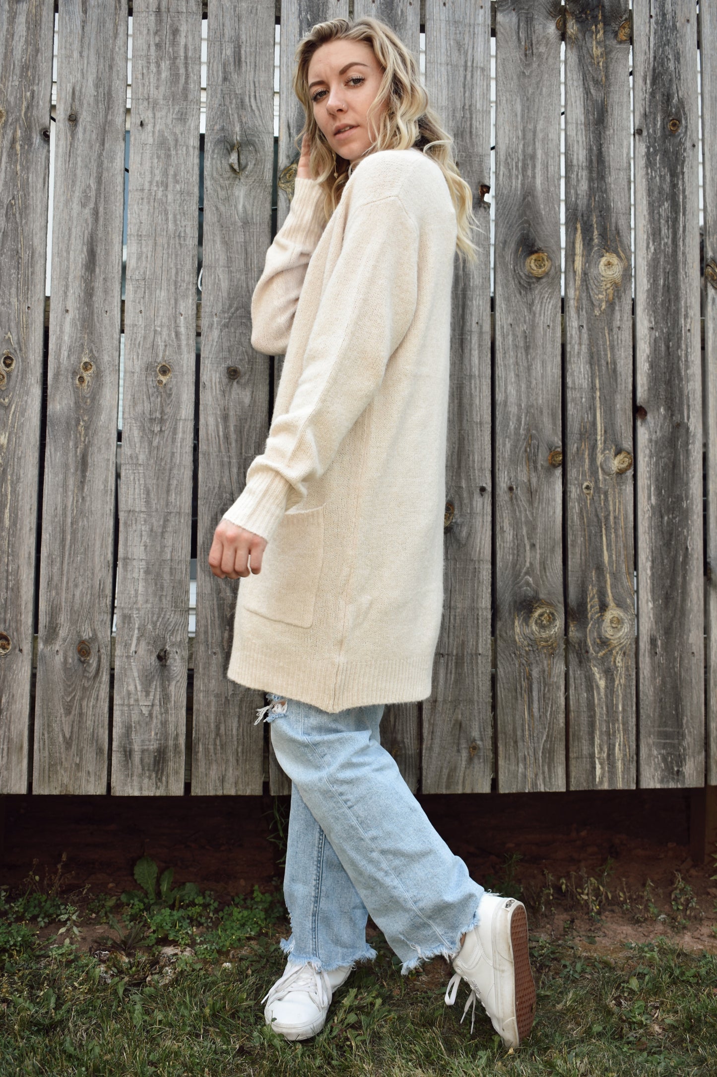 Open front knit cardigan in a natural color hits just above the knees and has two front patch pockets super cozy