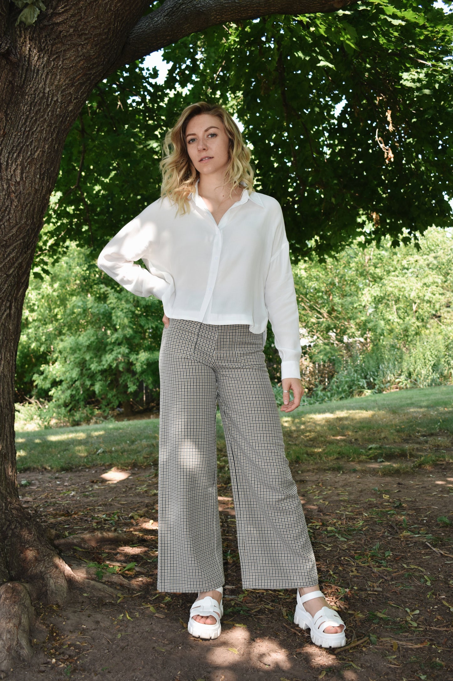 Black tan and white plaid wide leg pants with oversized front patch pockets high waisted with back pockets and a stretch fit.