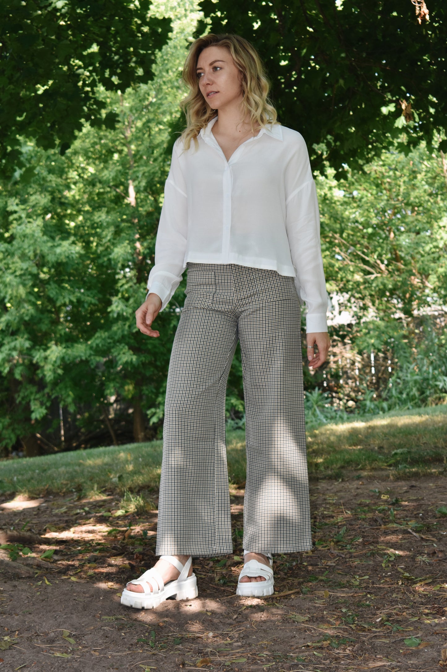 Black tan and white plaid wide leg pants with oversized front patch pockets high waisted with back pockets and a stretch fit.