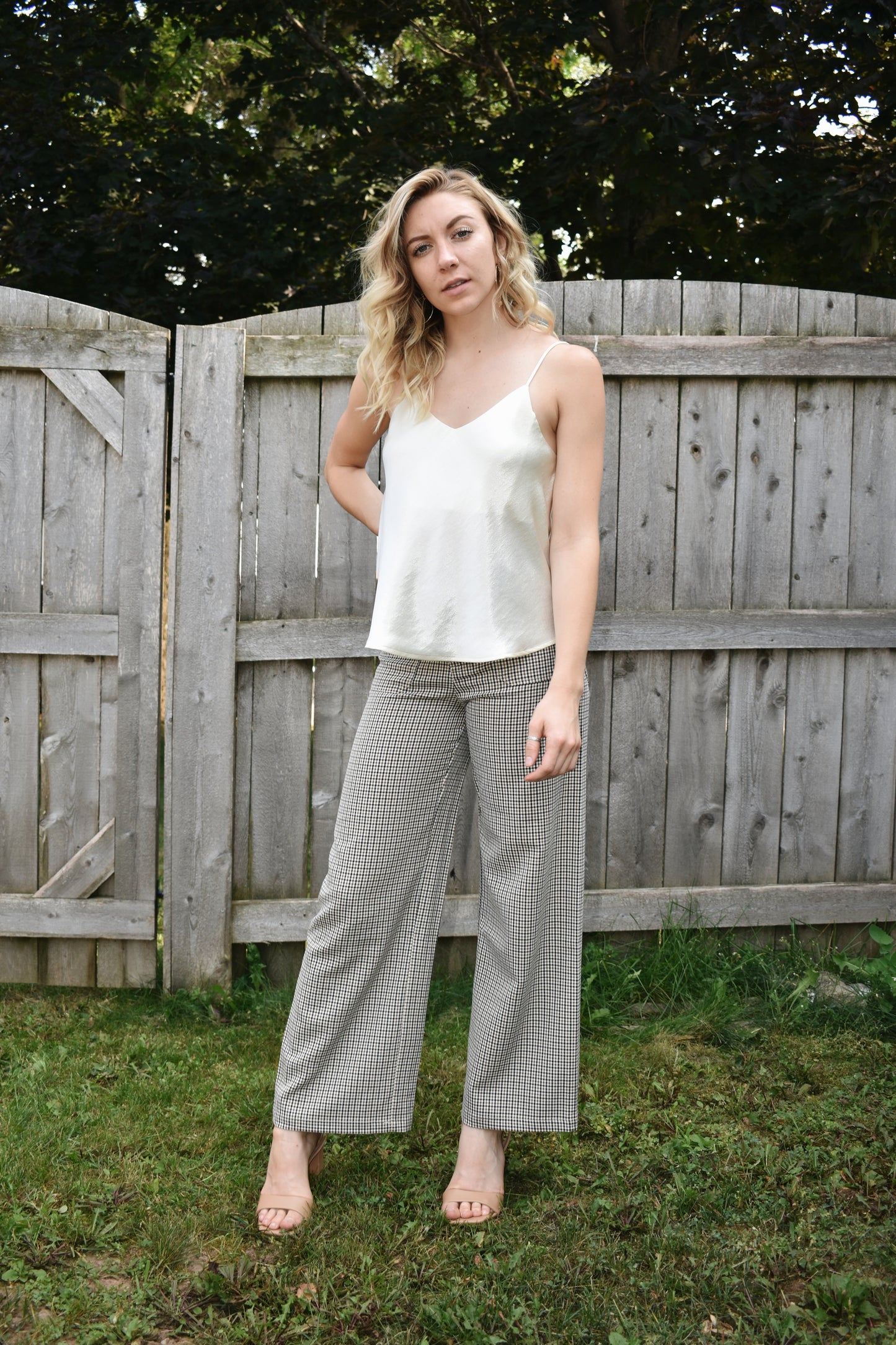 Ivory metallic sheen full length cami with adjustable spaghetti straps and a V neckline in the front and in the back