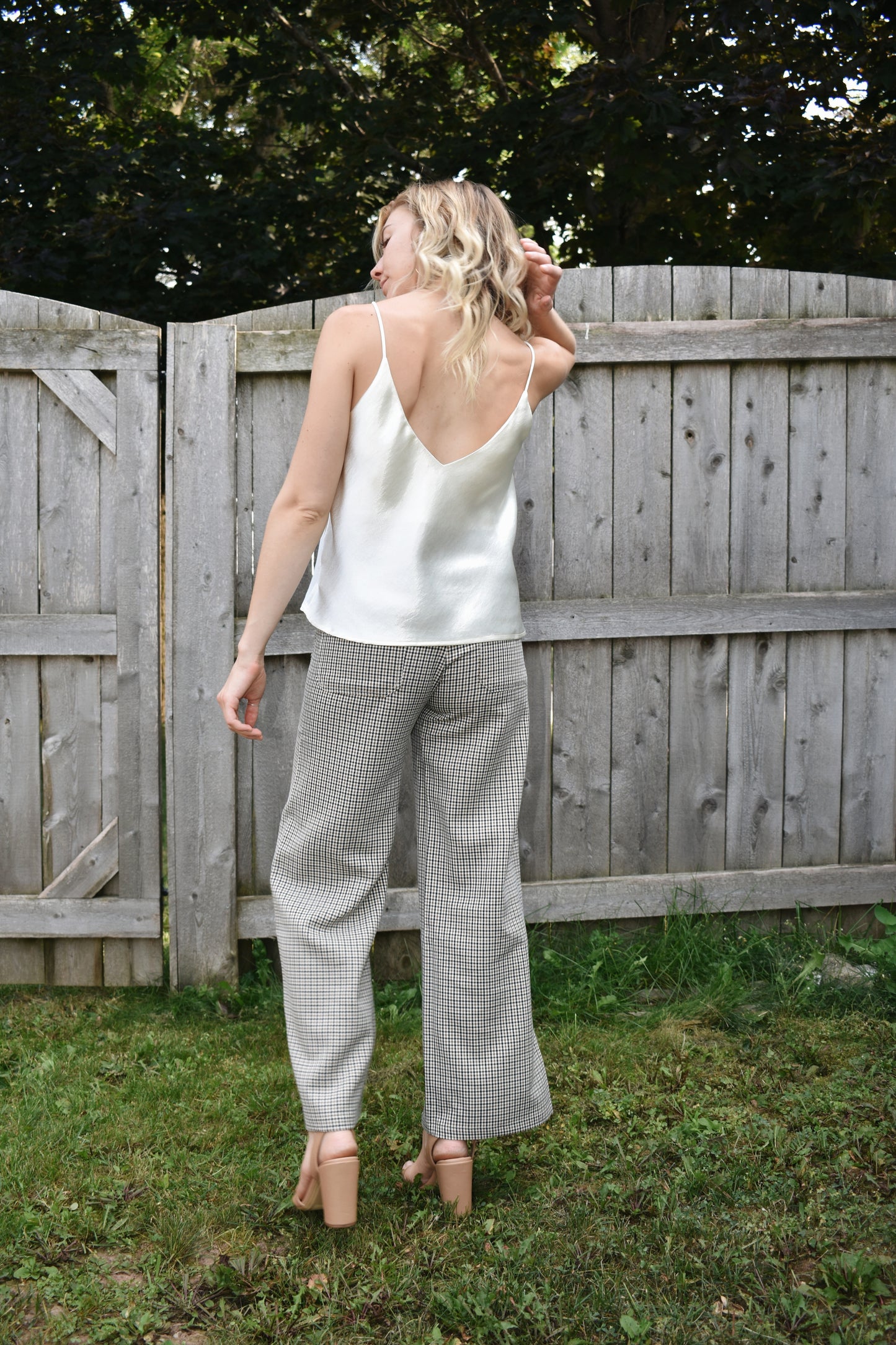 Ivory metallic sheen full length cami with adjustable spaghetti straps and a V neckline in the front and in the back