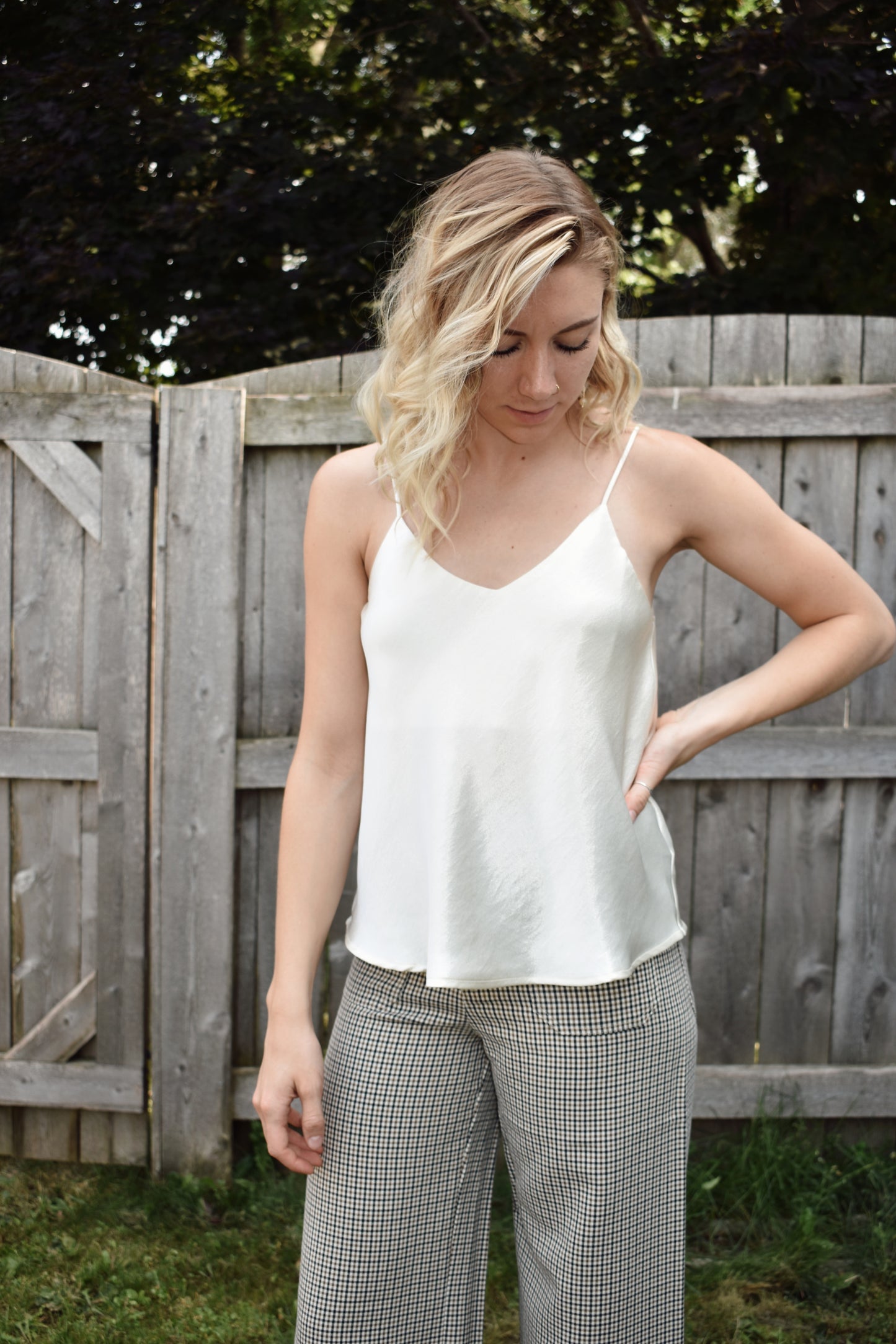 Ivory metallic sheen full length cami with adjustable spaghetti straps and a V neckline in the front and in the back