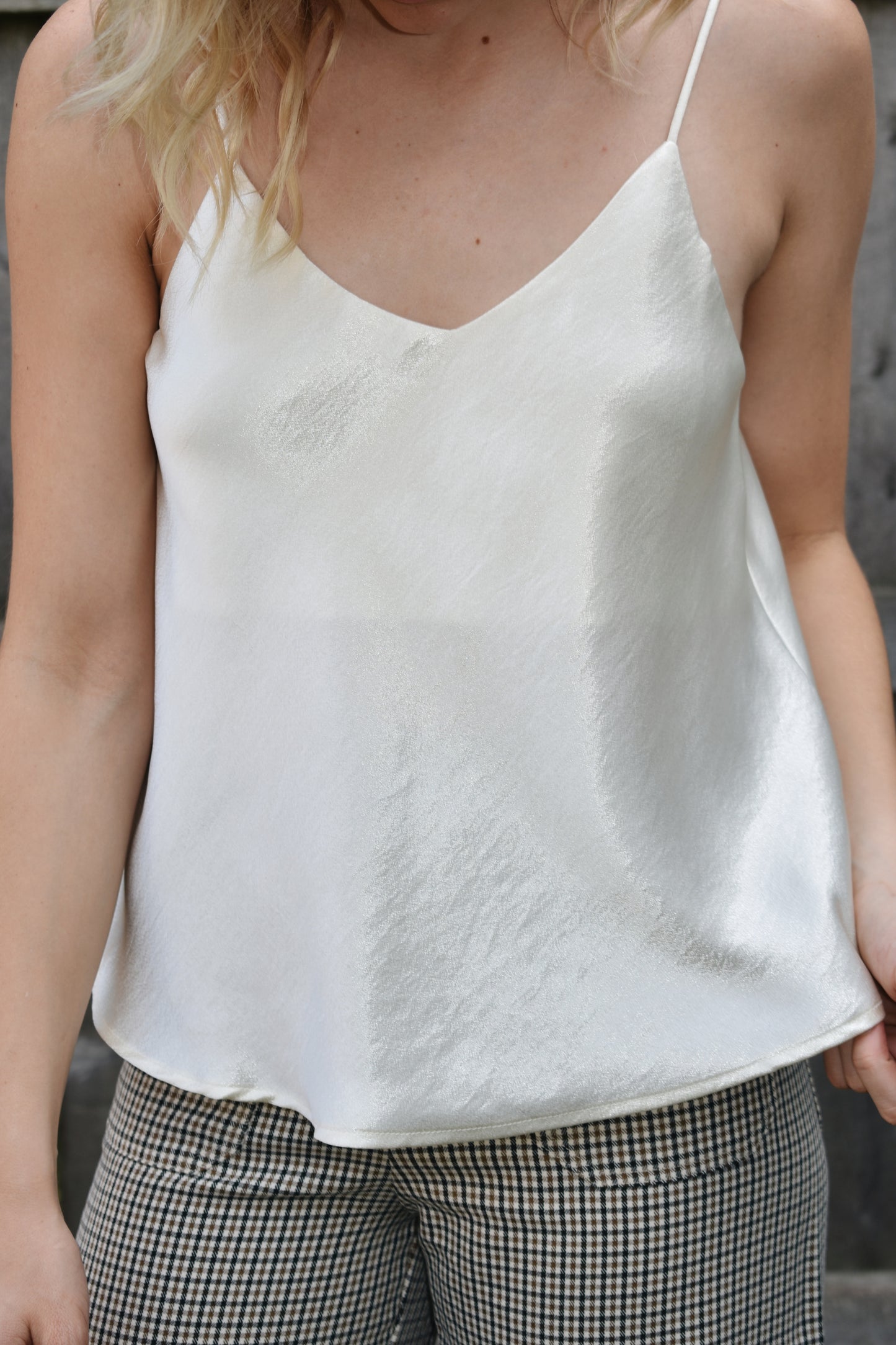 Ivory metallic sheen full length cami with adjustable spaghetti straps and a V neckline in the front and in the back