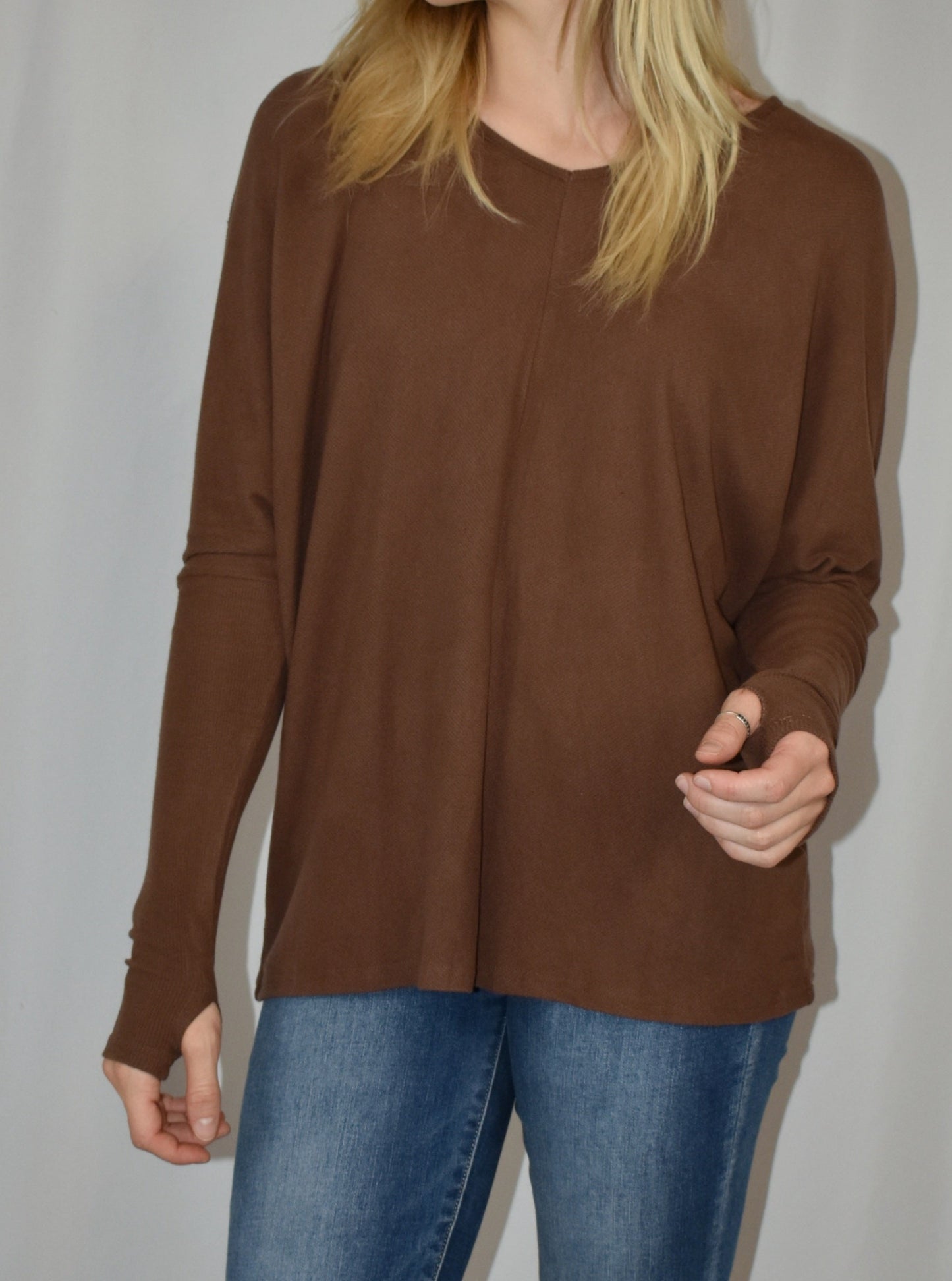 Brown ribbed long sleeve full length stretchy knit top with super soft fabric, dolman sleeves, thumb holes, and a v neck.