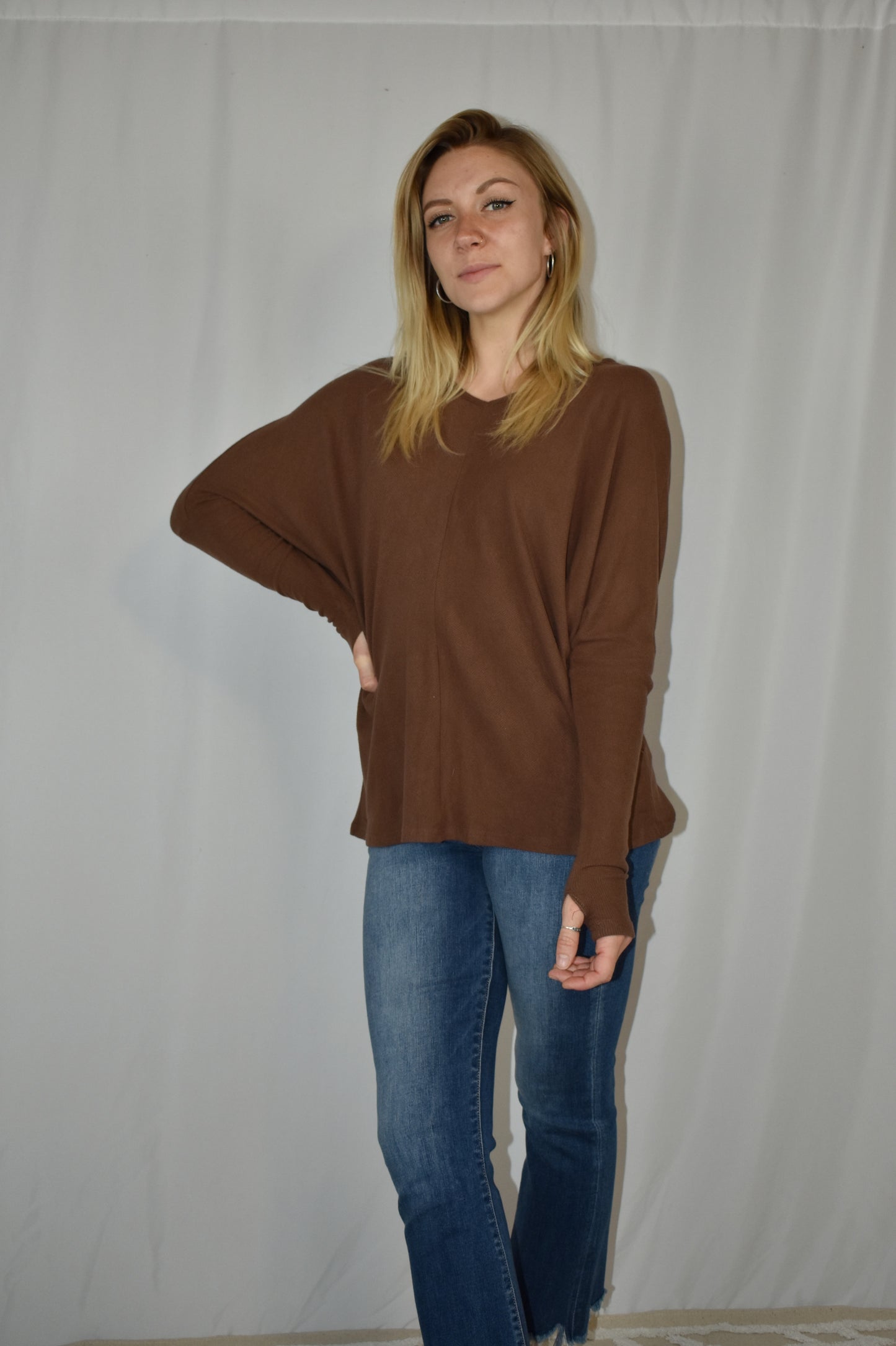 Brown ribbed long sleeve full length stretchy knit top with super soft fabric, dolman sleeves, thumb holes, and a v neck.