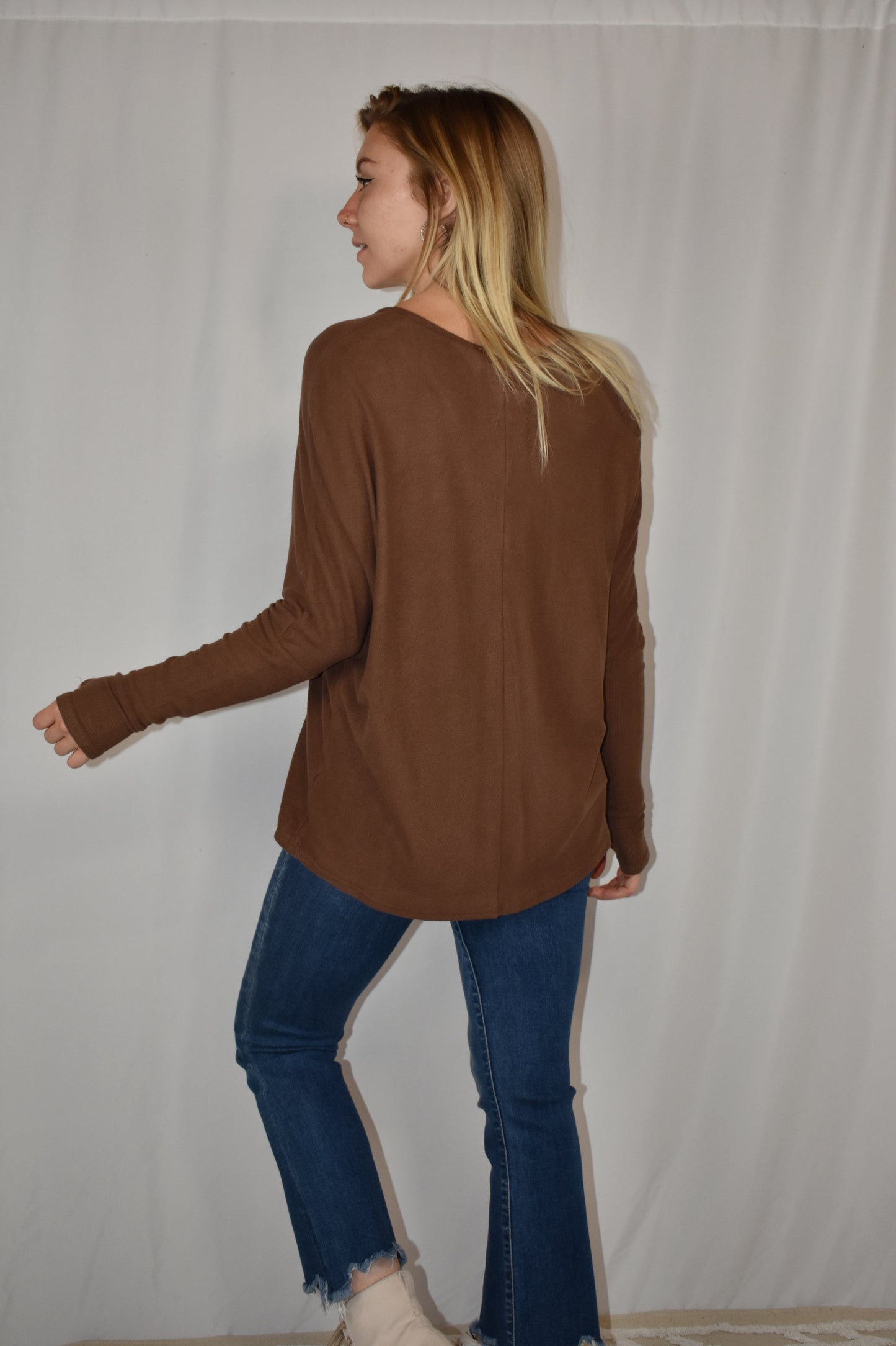 Brown ribbed long sleeve full length stretchy knit top with super soft fabric, dolman sleeves, thumb holes, and a v neck.