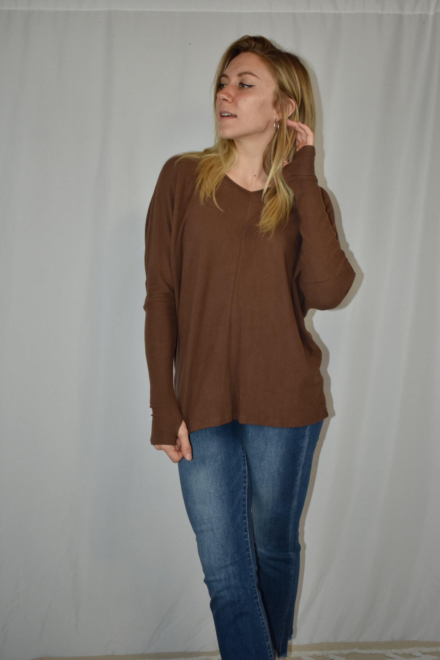 Brown ribbed long sleeve full length stretchy knit top with super soft fabric, dolman sleeves, thumb holes, and a v neck.