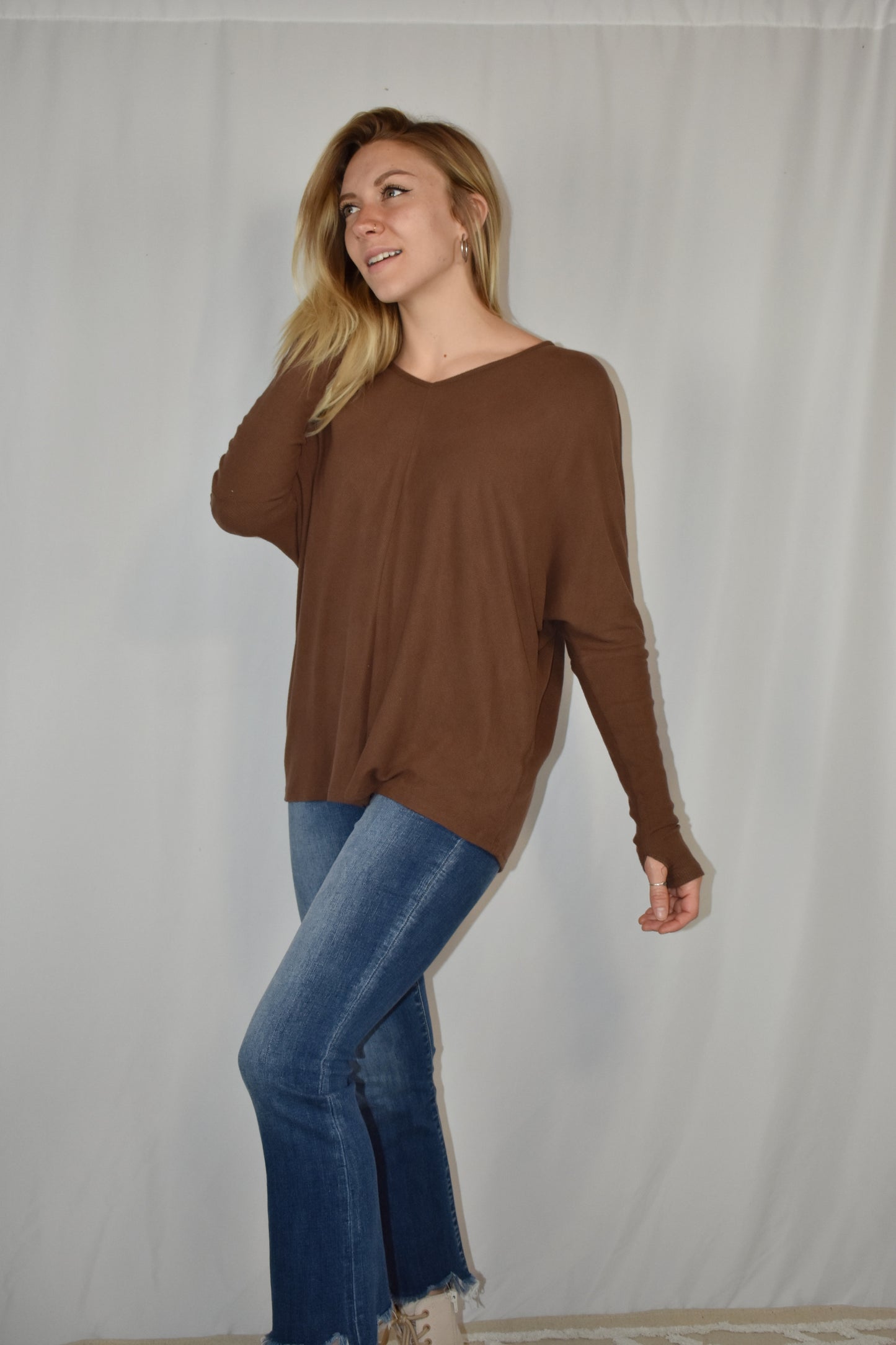Brown ribbed long sleeve full length stretchy knit top with super soft fabric, dolman sleeves, thumb holes, and a v neck.