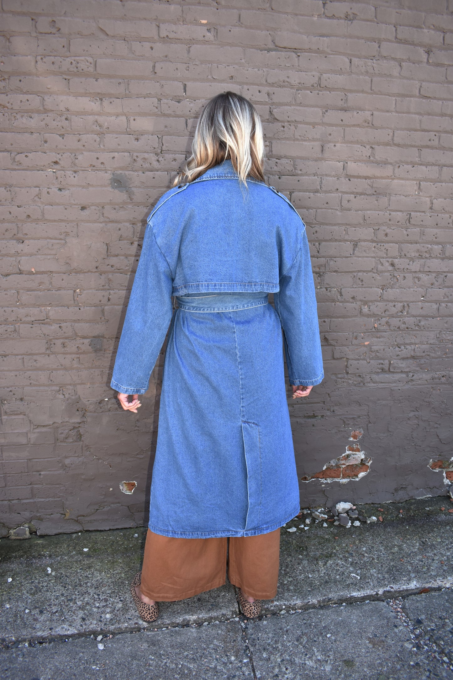 oversized denim trench coat medium wash, double breasted, button front and side pockets, denim tie for waist.