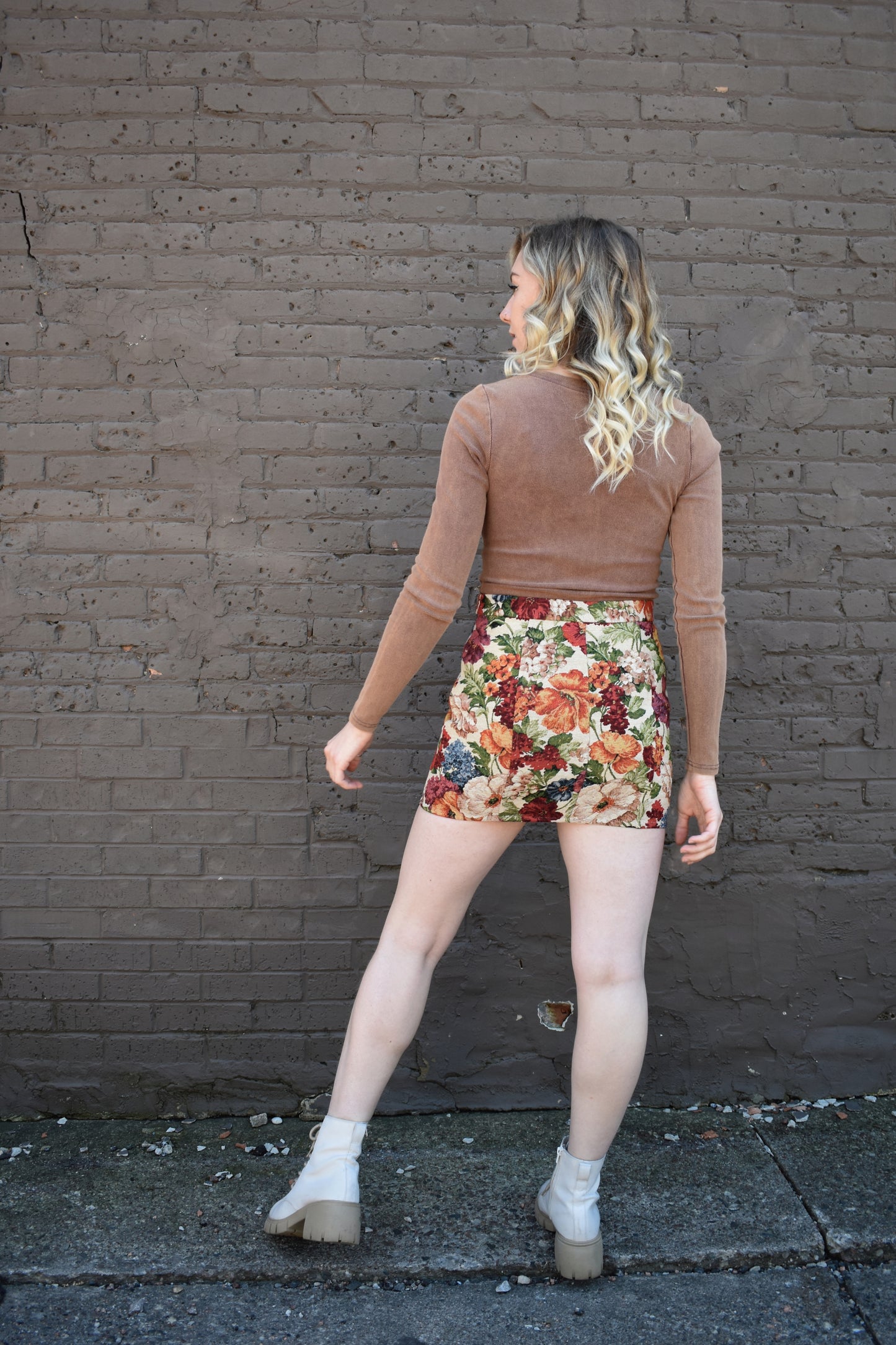multicolored floral tapestry mini skirt. retro style. taupe background.