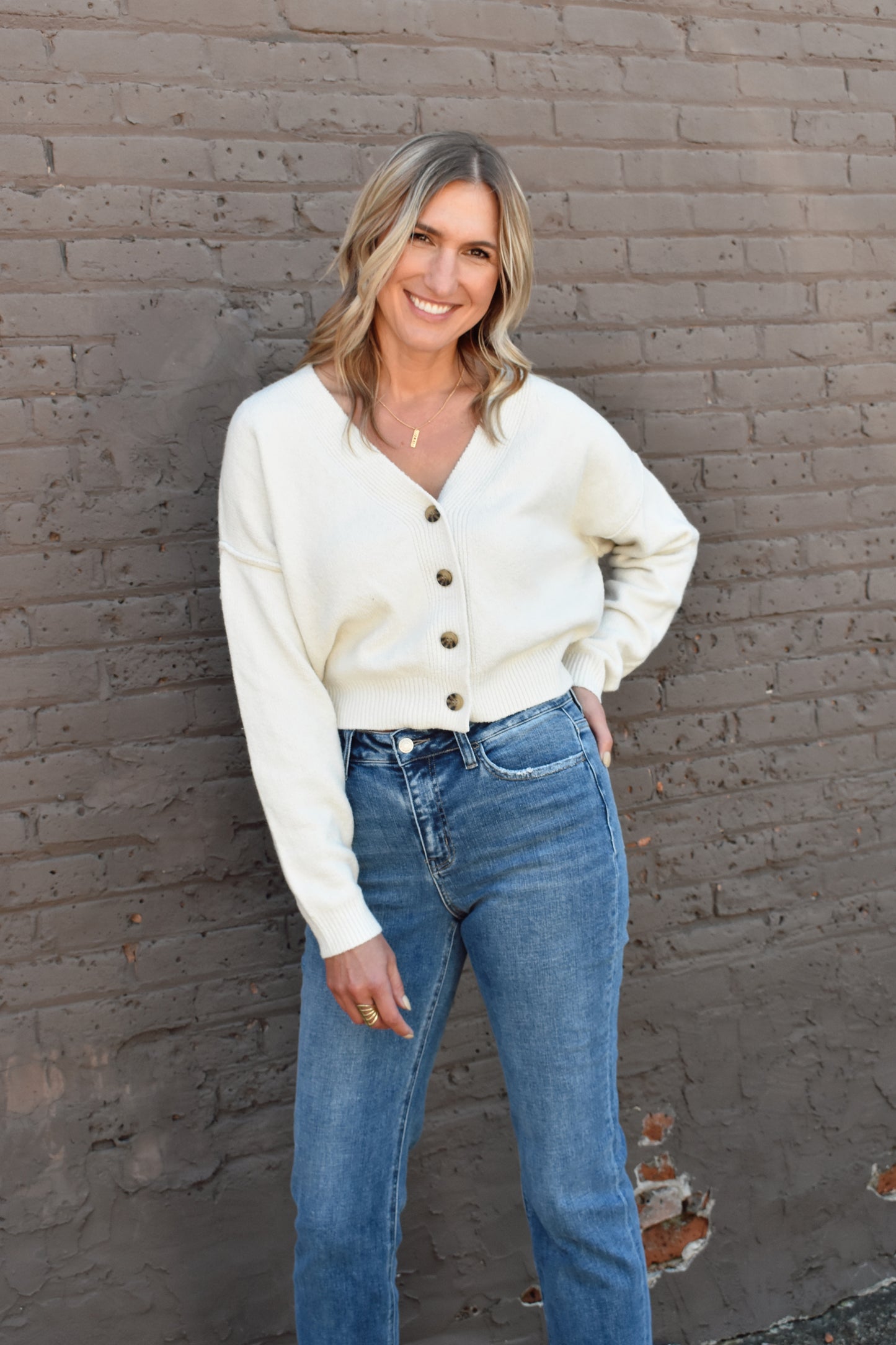 cropped v neck button front drop shoulder cardigan with ribbed cuffs and hem