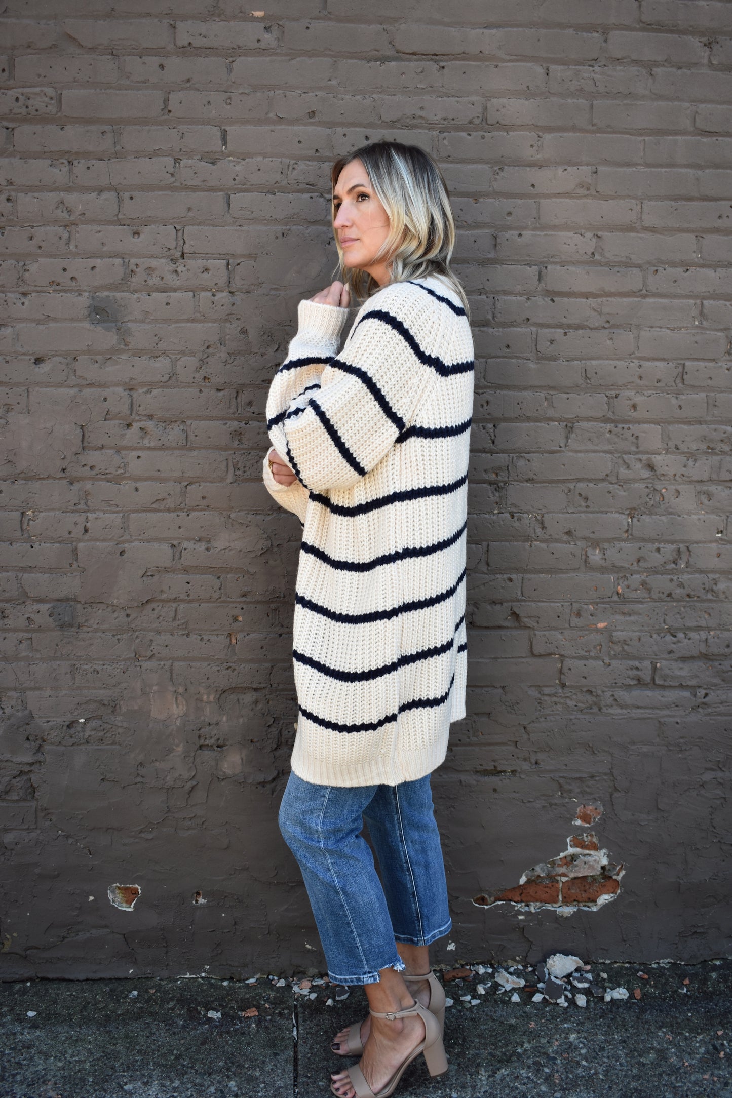 oversized long knit cardigan. cream with navy stripes. button front.