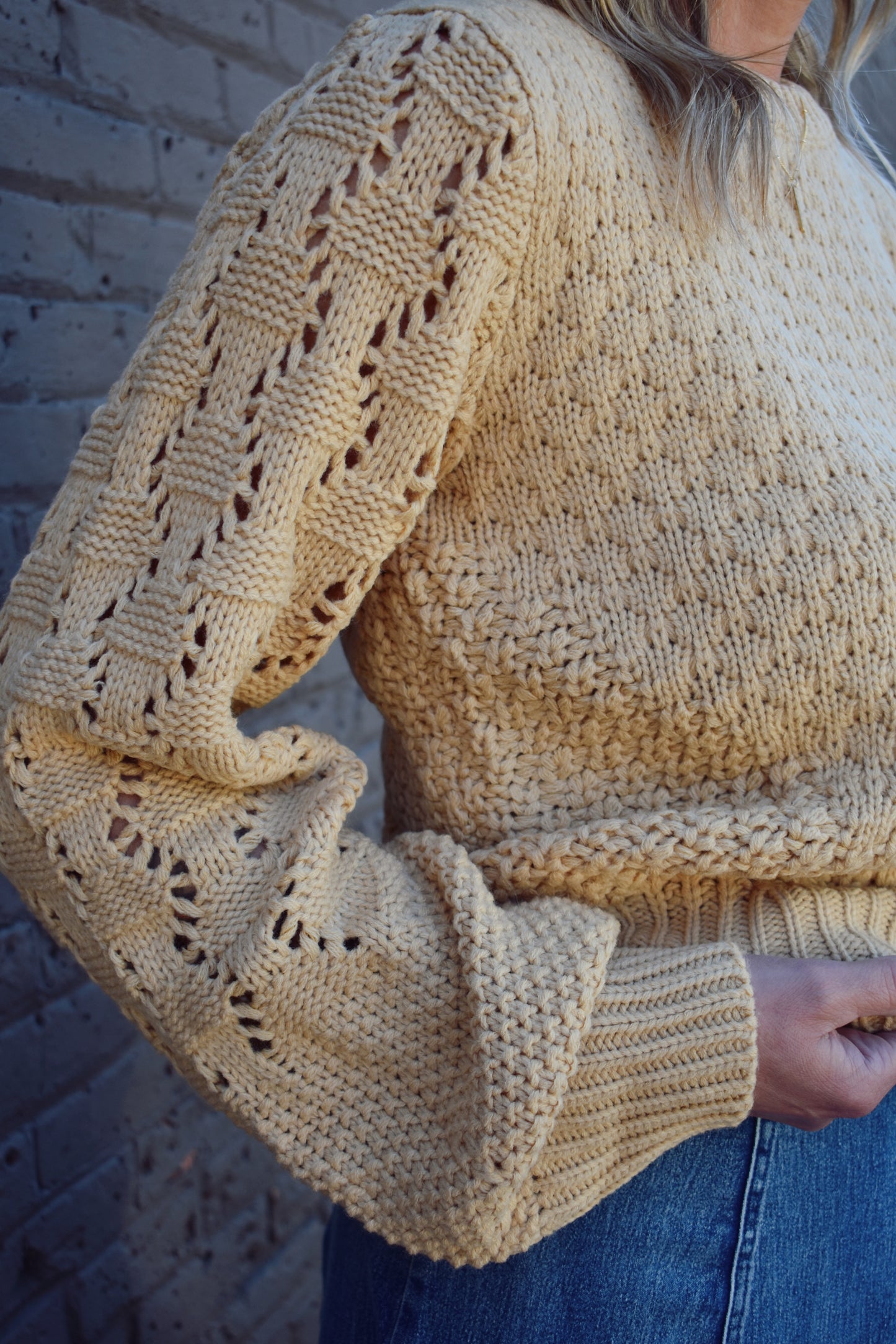 cool taupe mixed pointelle knit design sweater with ribbed cuffs and hem and long puff sleeves