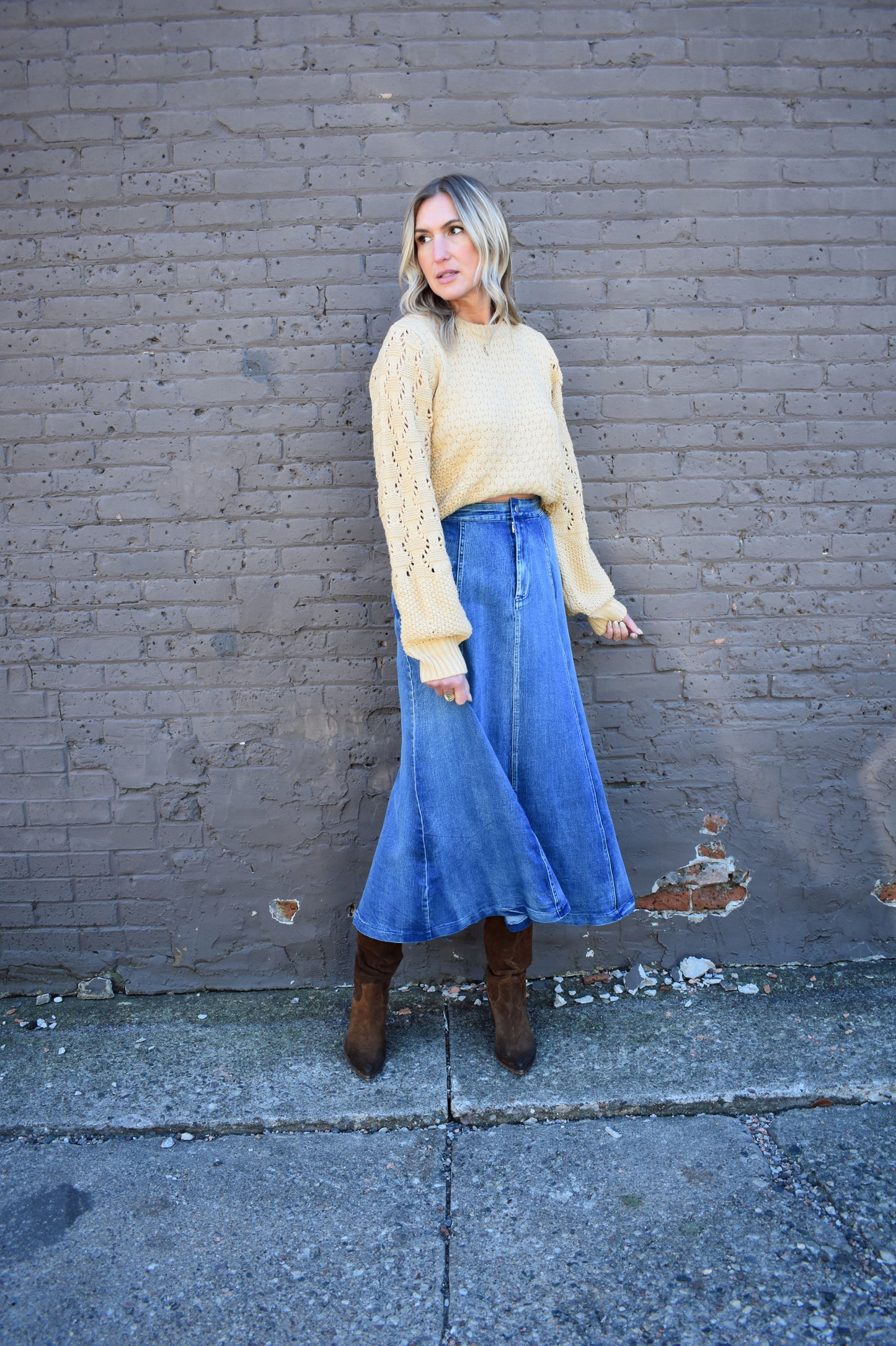 Denim swing midi skirt with seam detail along front, medium wash, button closure.