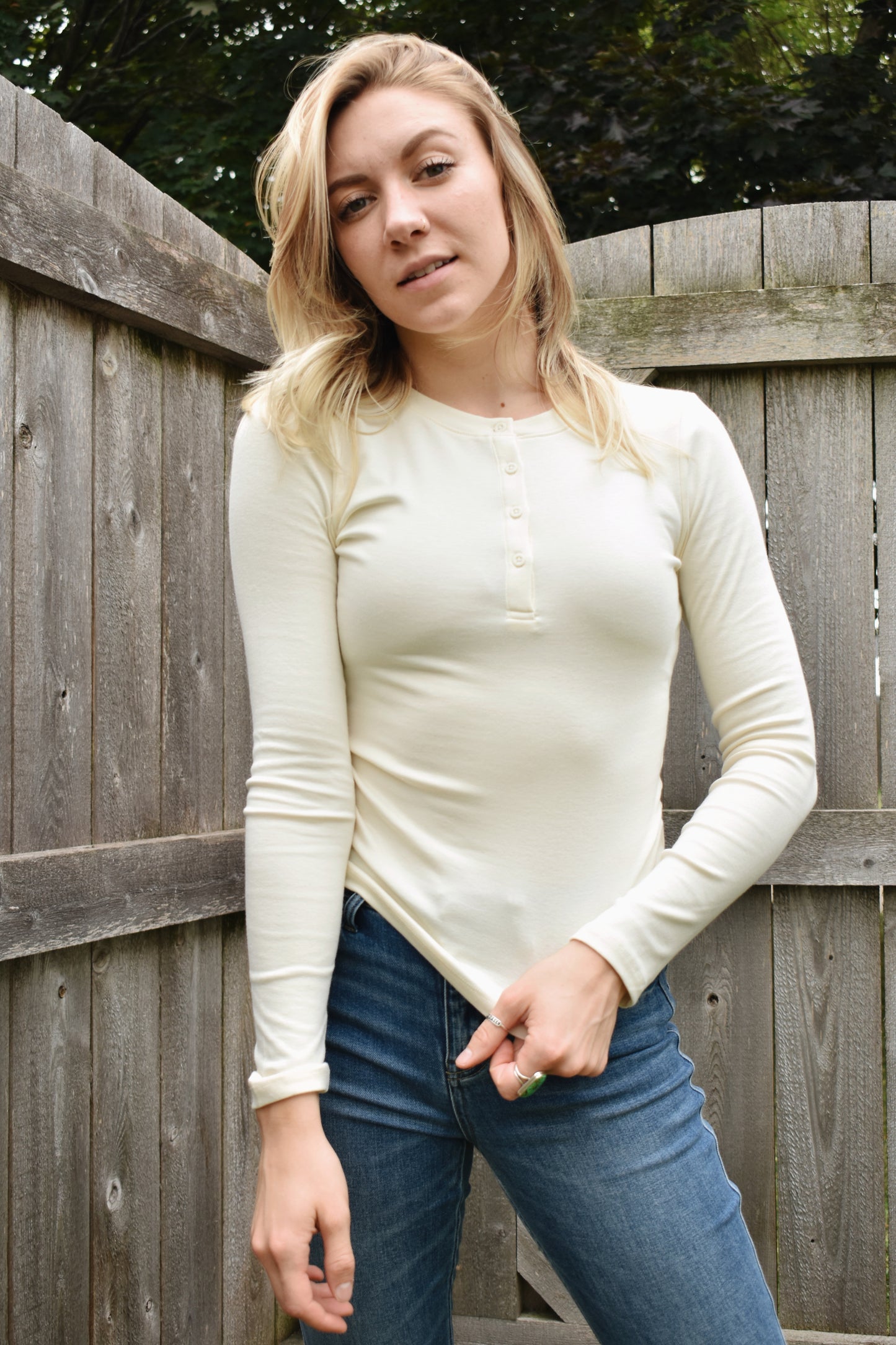 fitted full length long sleeve henley with four buttons on the front crew neck stretchy