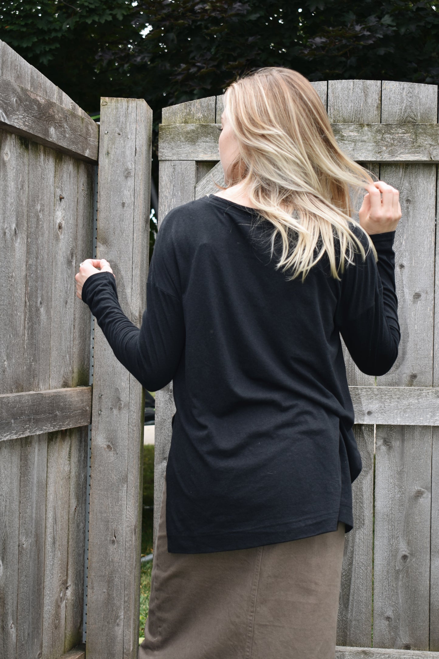 long sleeve loose fitting top with drop shoulders, round neck and splits on the hem on the sides