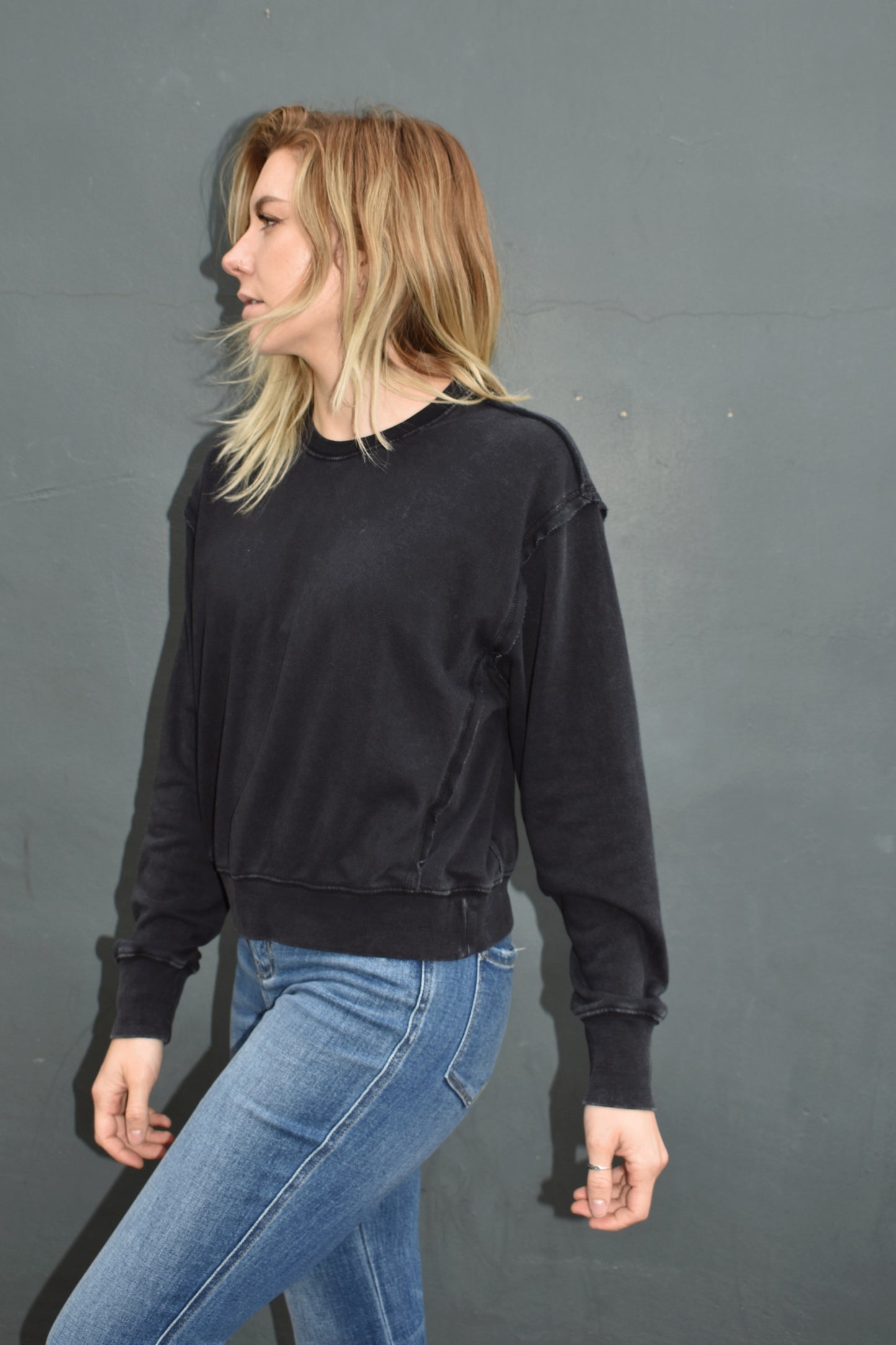 black drop shoulder full length sweatshirt, no hood, raw hem edge detail, ribbed cuffs