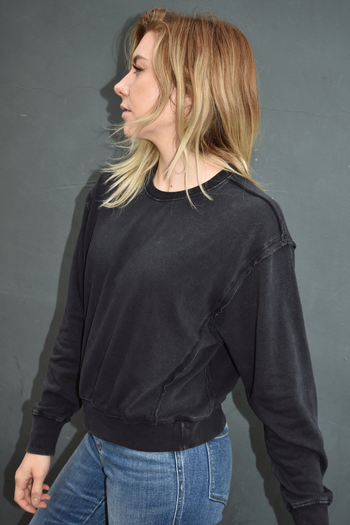 black drop shoulder full length sweatshirt, no hood, raw hem edge detail, ribbed cuffs