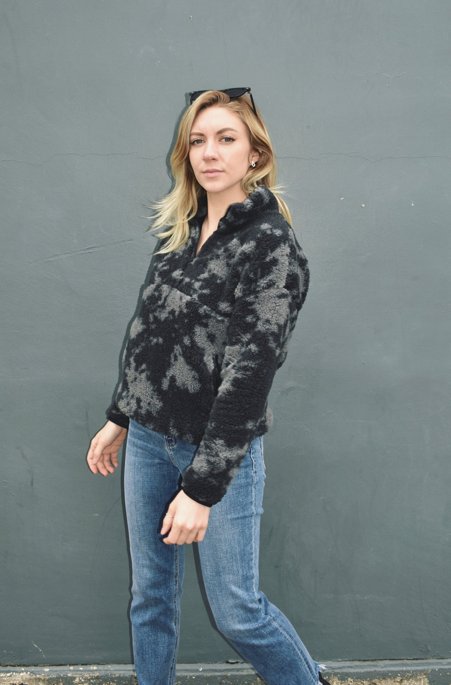 Black and gray blot pattern sherpa pullover with lightweight jersey liner and half zip collar