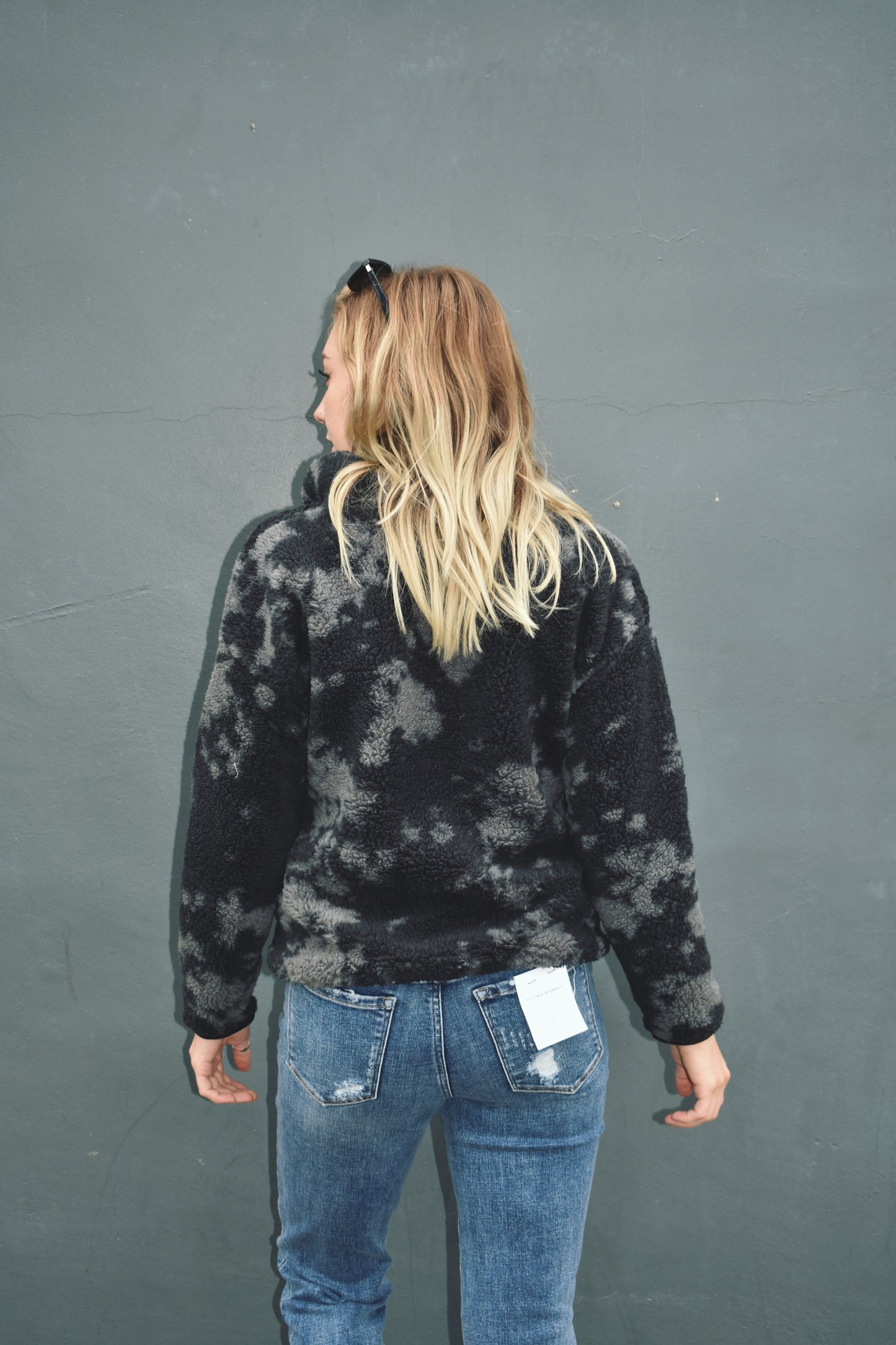 Black and gray blot pattern sherpa pullover with lightweight jersey liner and half zip collar