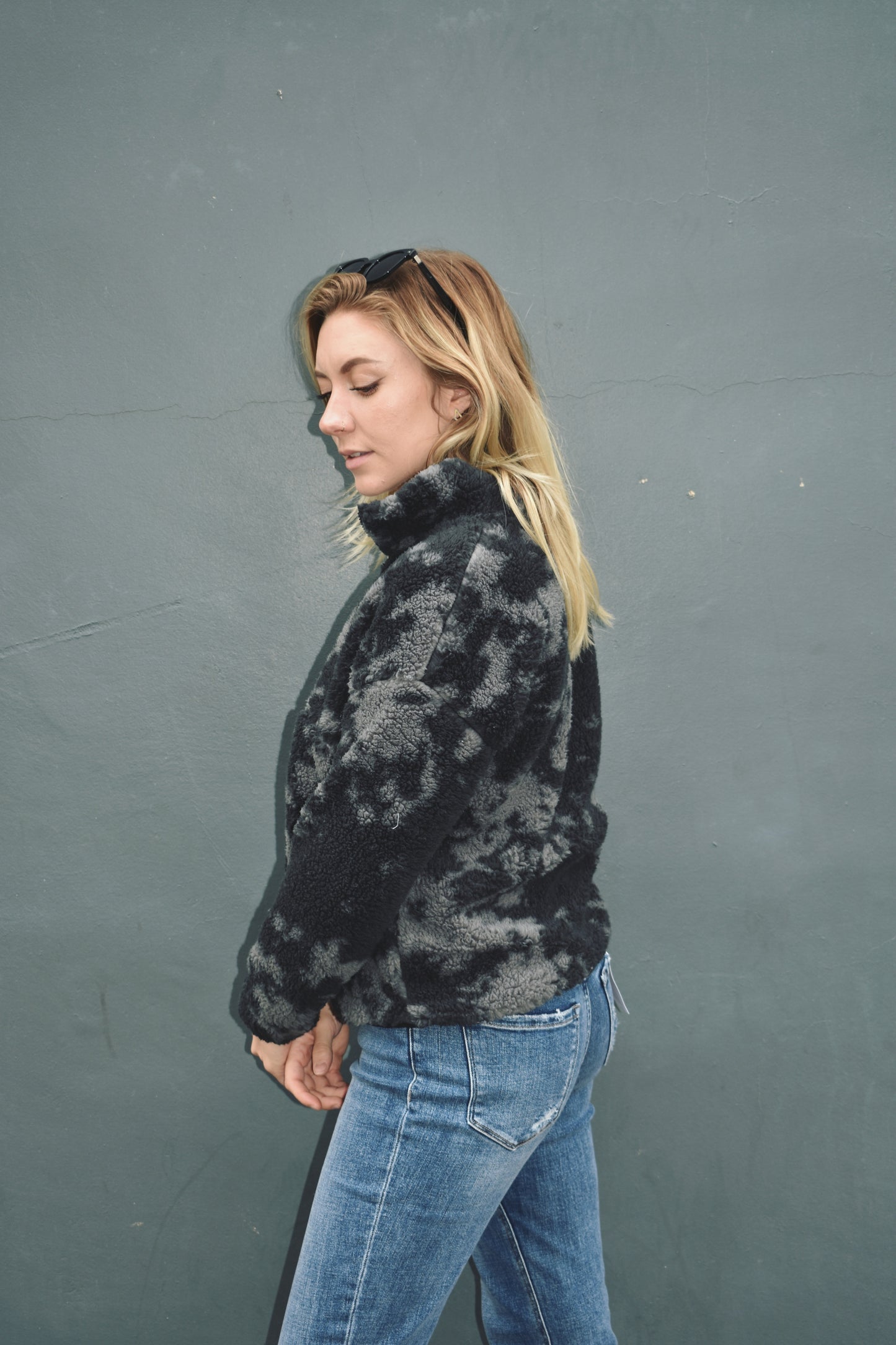 Black and gray blot pattern sherpa pullover with lightweight jersey liner and half zip collar