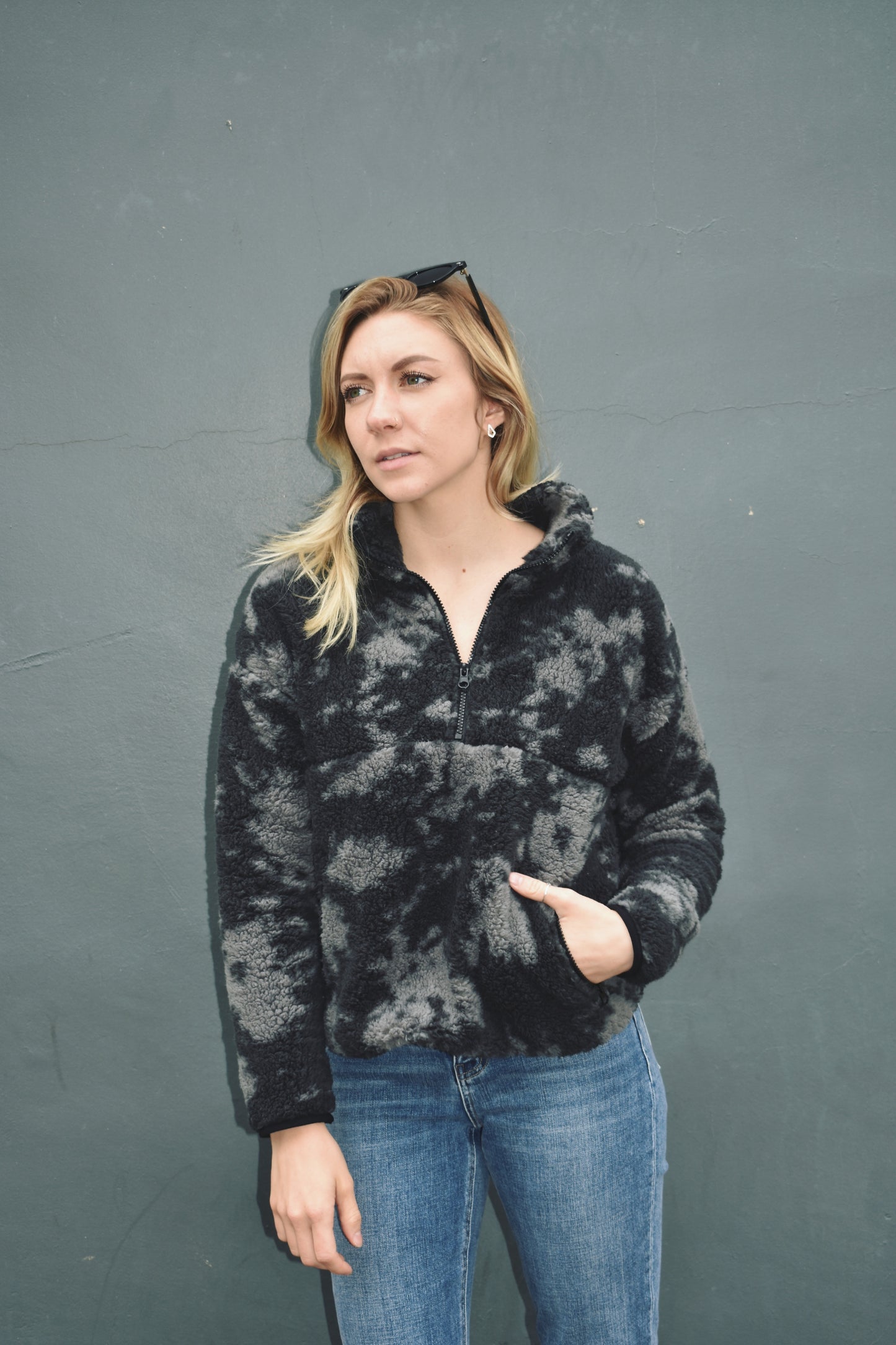 Black and gray blot pattern sherpa pullover with lightweight jersey liner and half zip collar