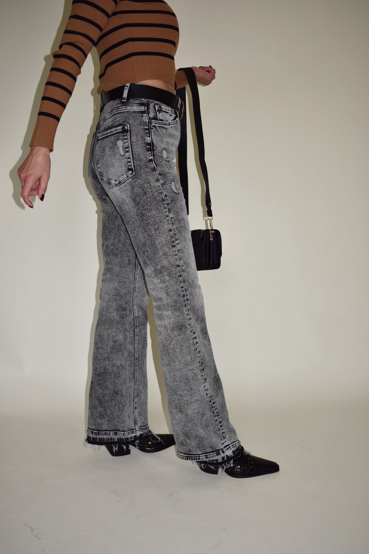 flared stretch denim jeans with gray and black acid wash high rise