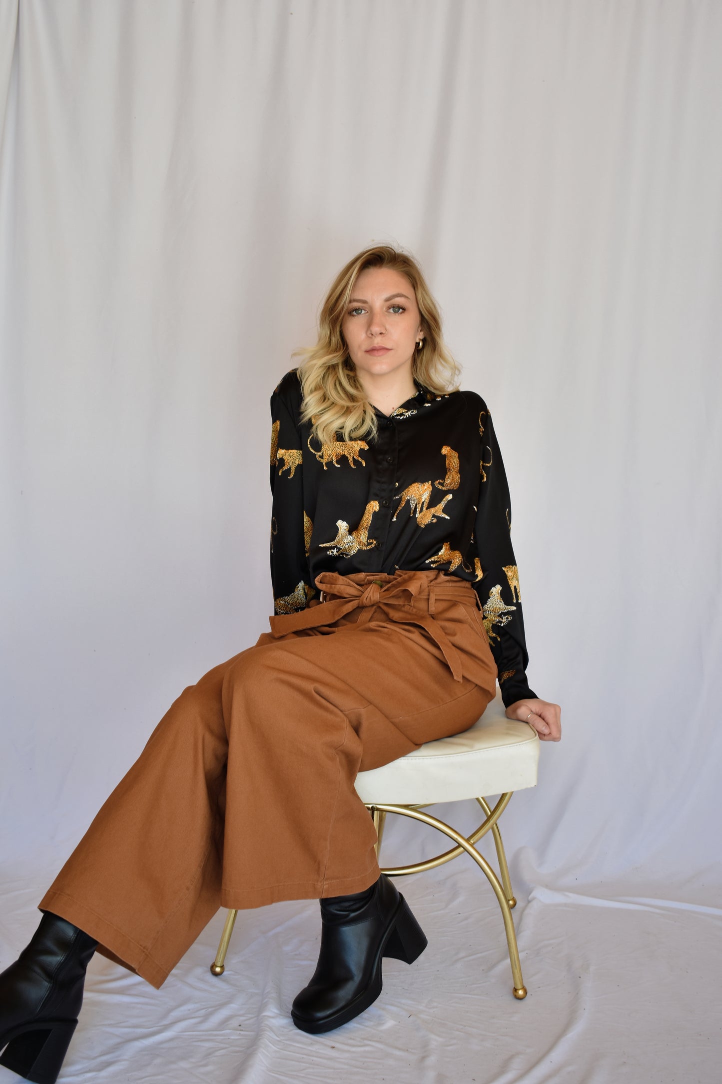 black satin button down with print of small cheetahs all over it button cuffs