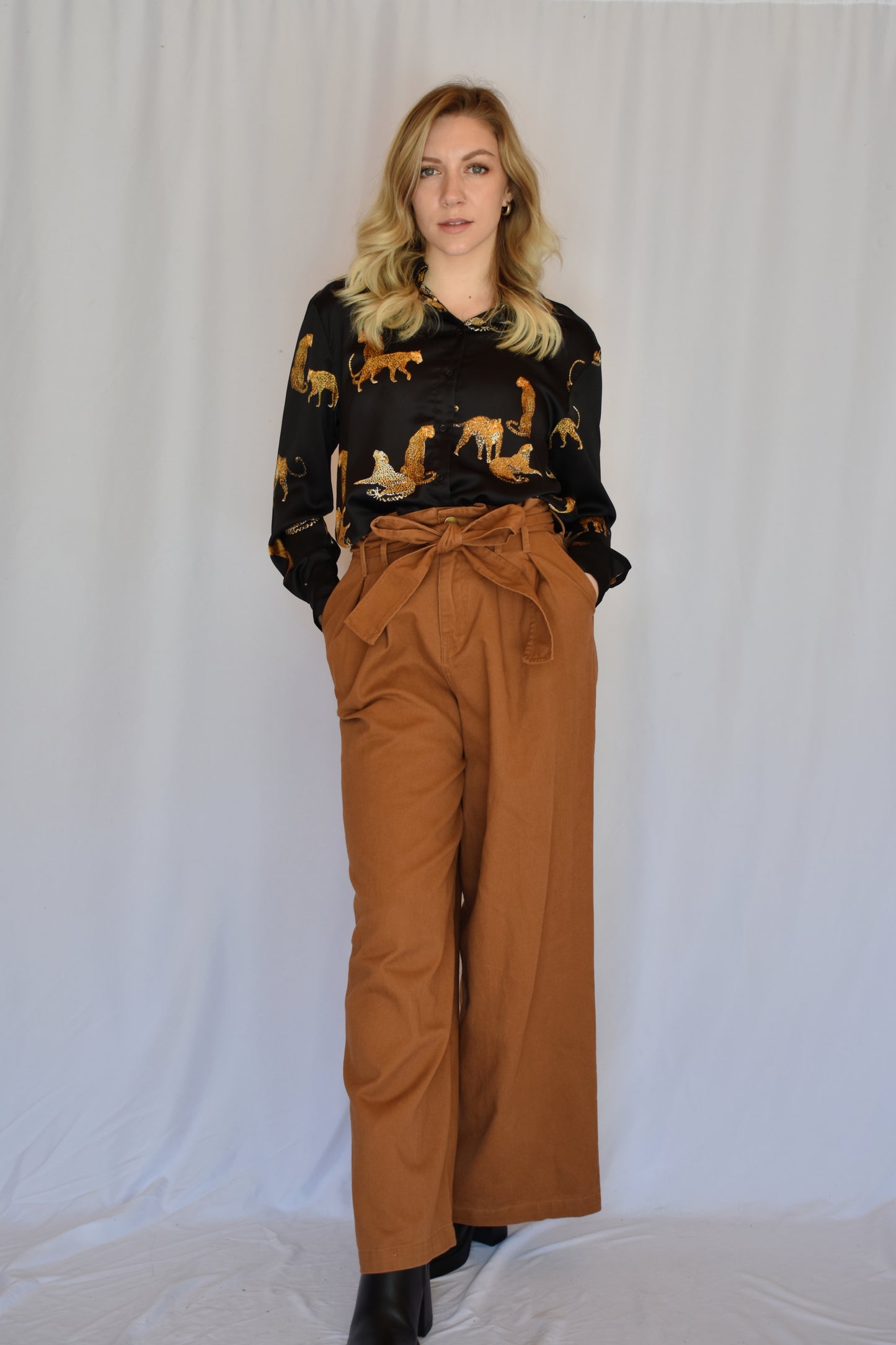 black satin button down with print of small cheetahs all over it button cuffs