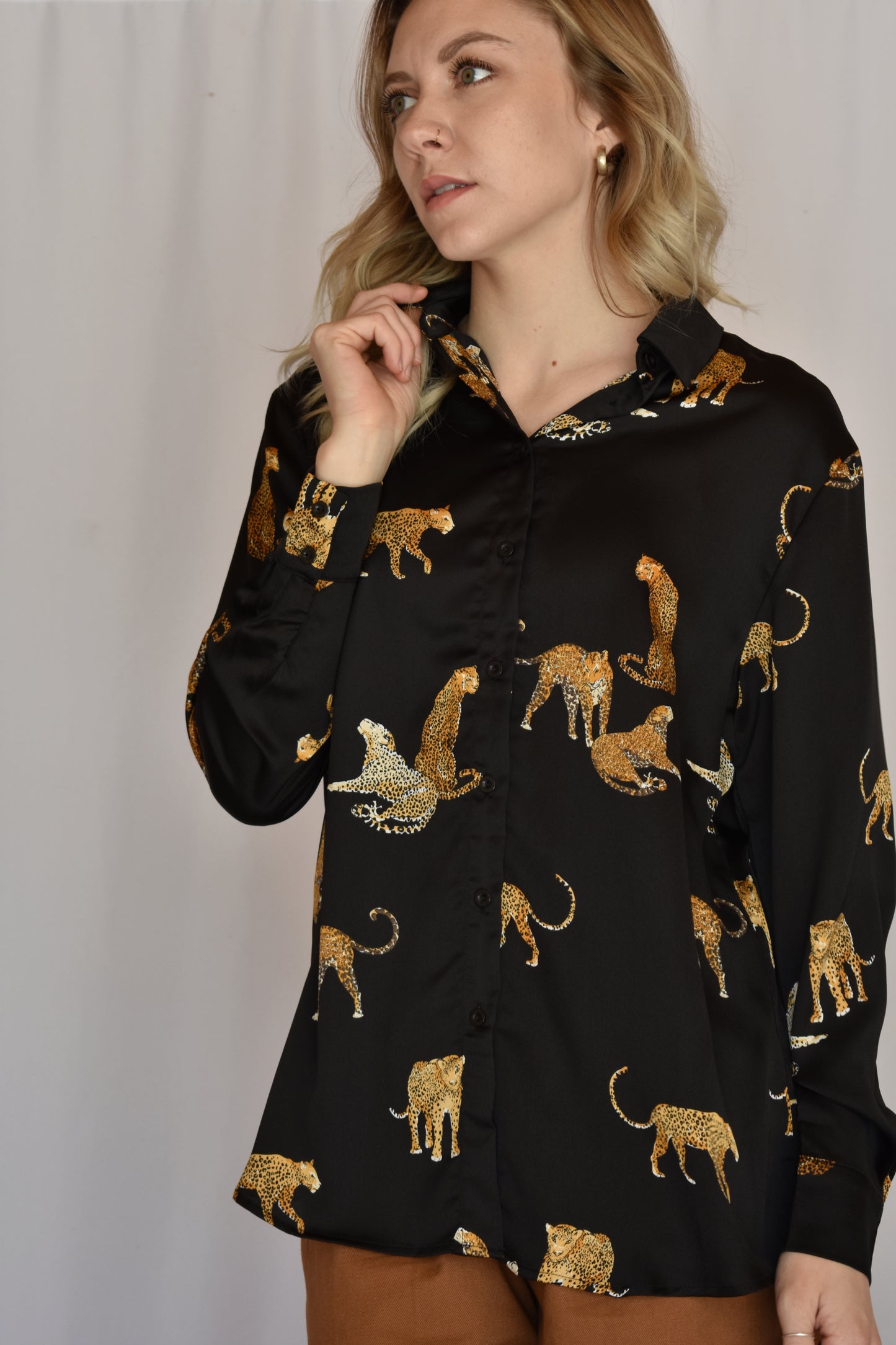 black satin button down with print of small cheetahs all over it button cuffs
