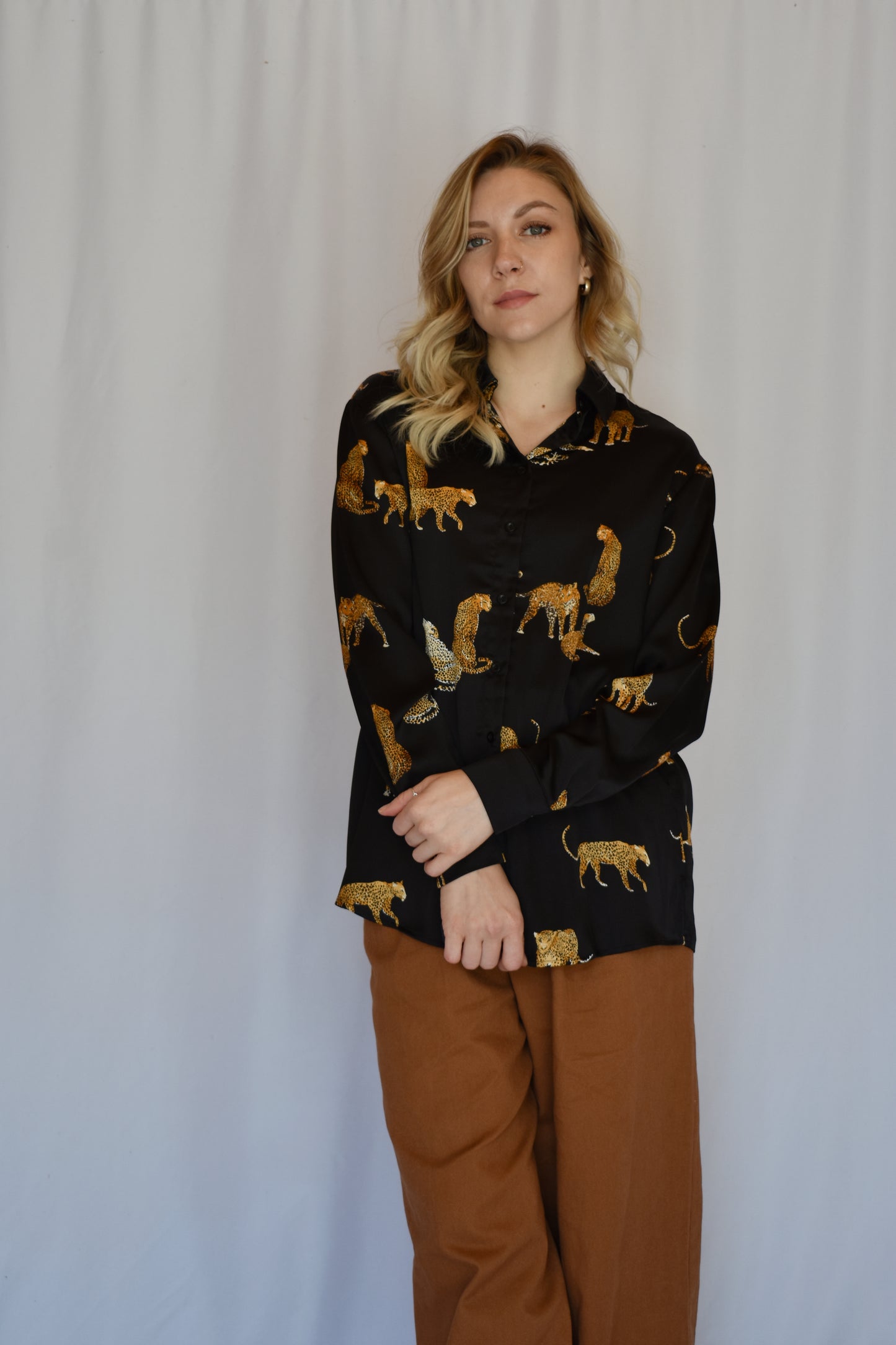 black satin button down with print of small cheetahs all over it button cuffs