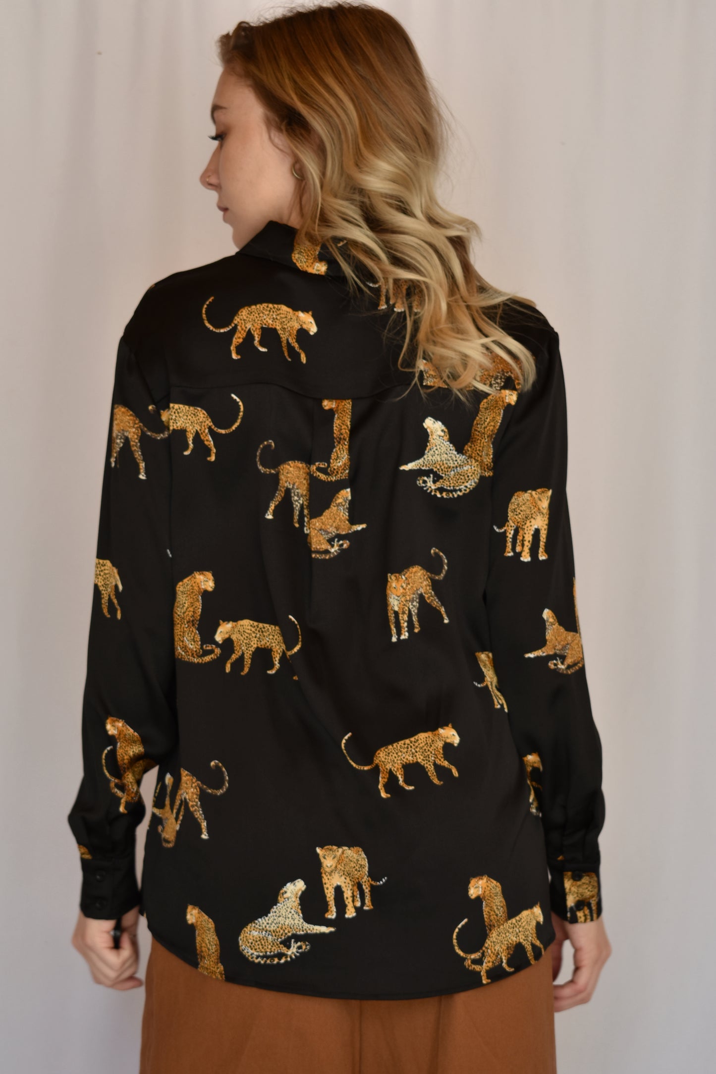black satin button down with print of small cheetahs all over it button cuffs
